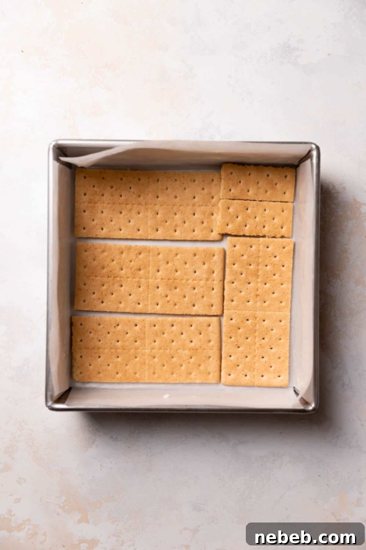 a layer of graham crackers in the bottom of a square baking pan.