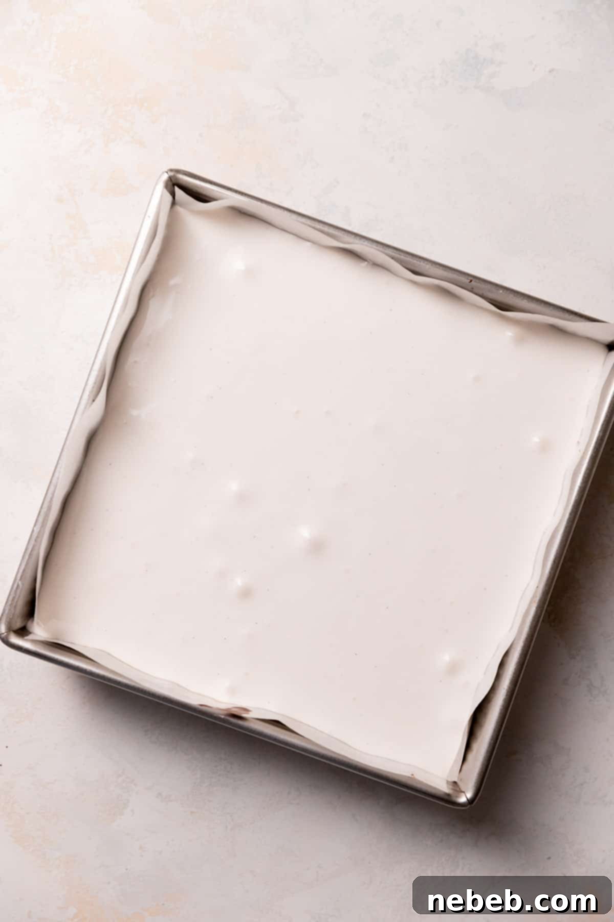 a baking pan with the vanilla bean marshmallow on top.