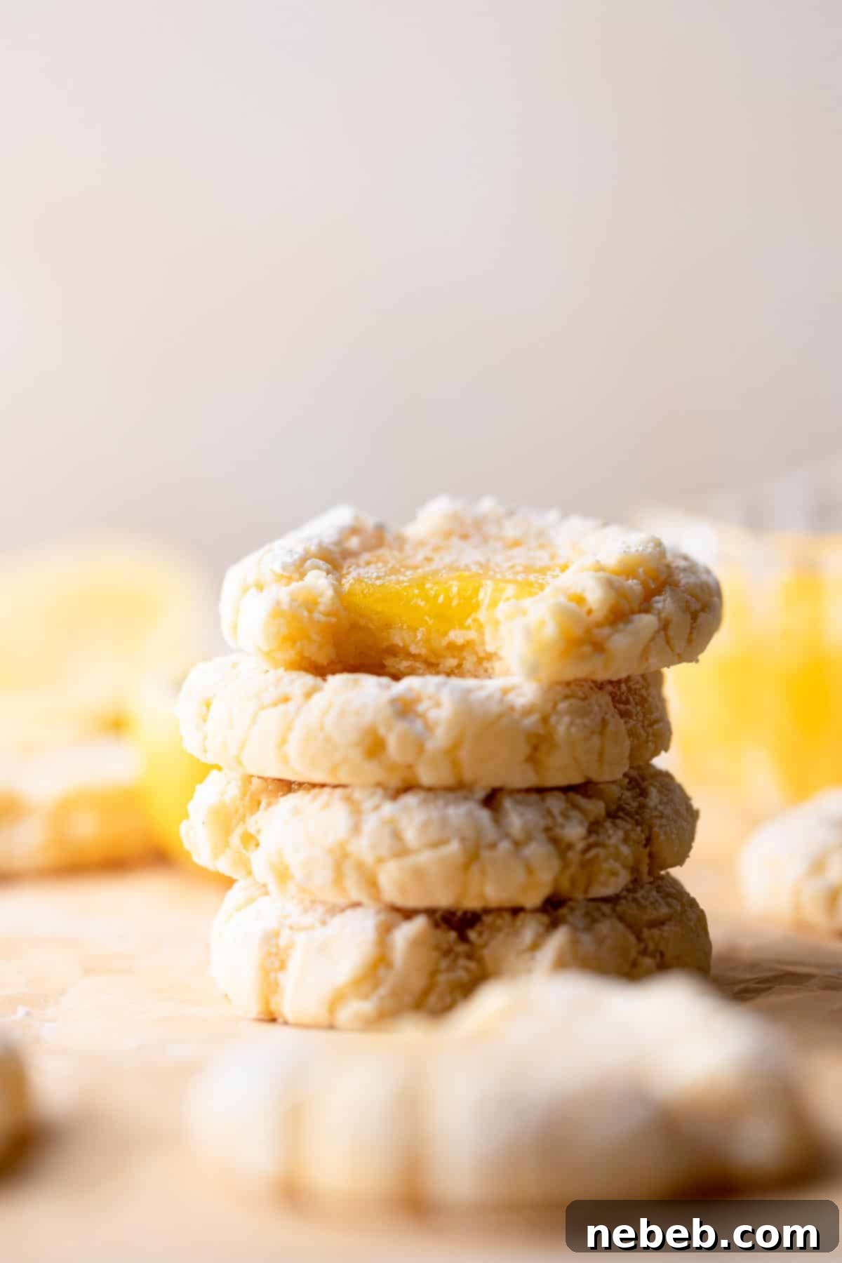 Simple Sunshine Lemon Squares 6 lemon bar cookies stacked on top of each other.