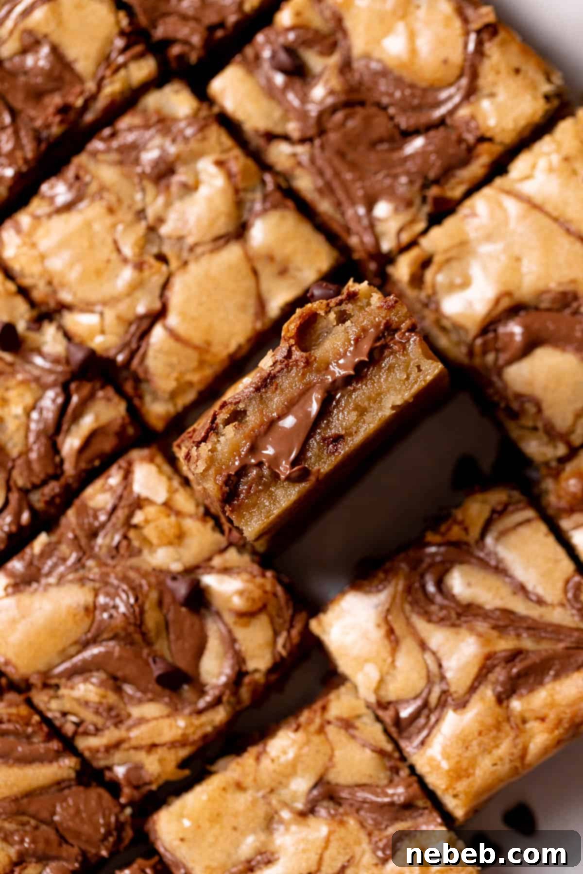 cookie bars stuffed with nutella on white parchment paper.