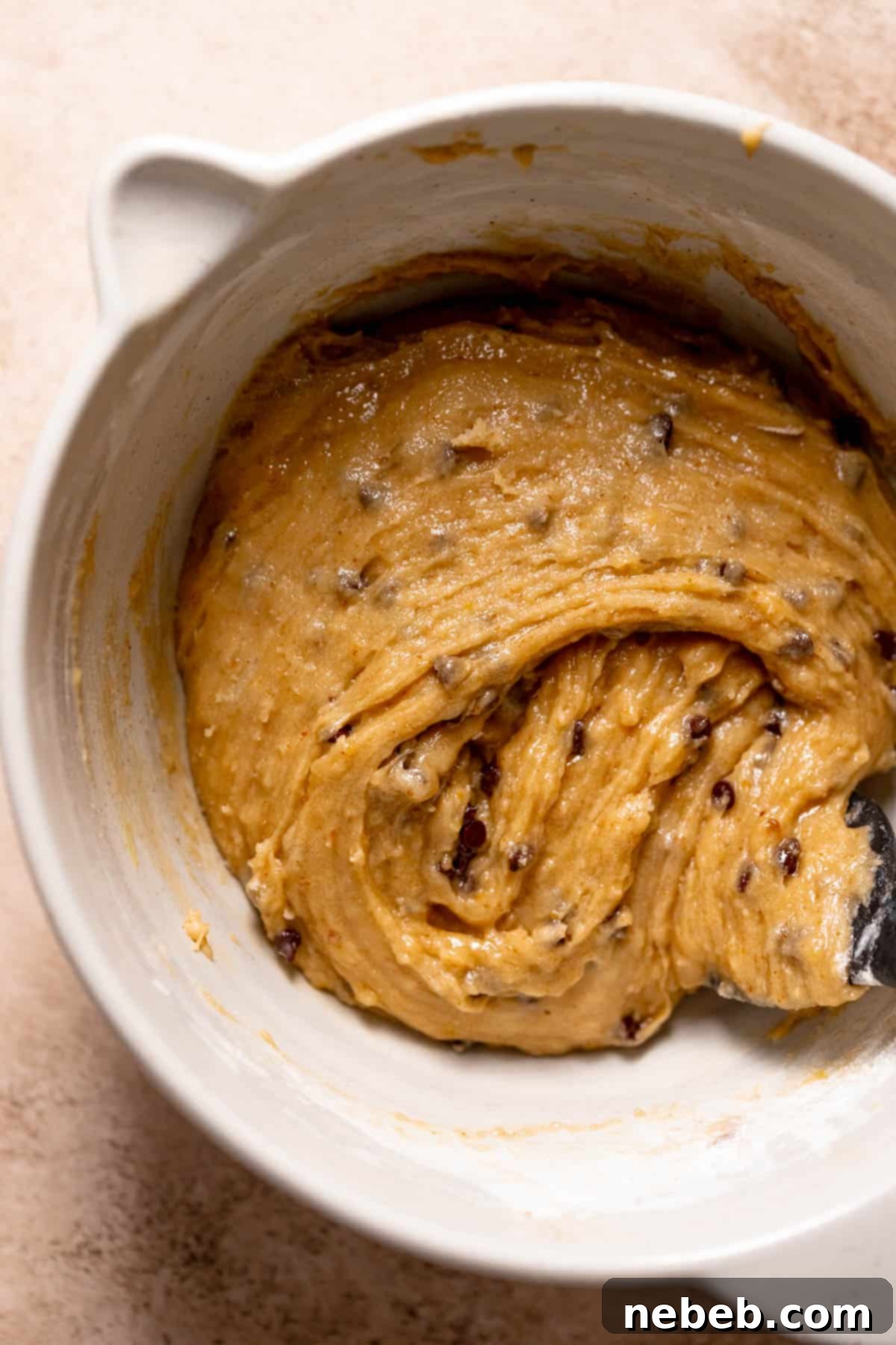 chocolate chip cookie dough in a mixing bowl.