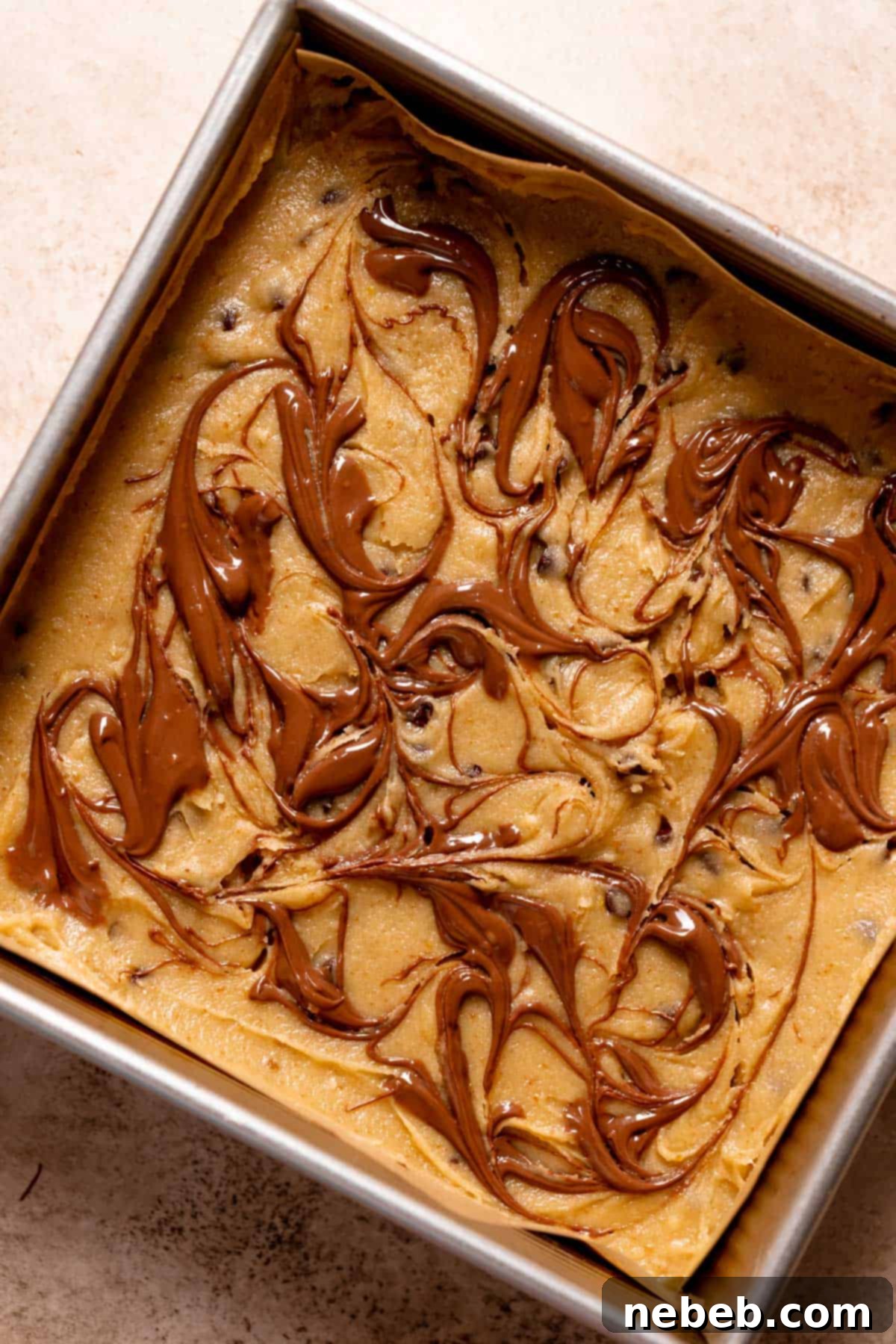 the top of the nutella bars swirled with melted nutella before baking.