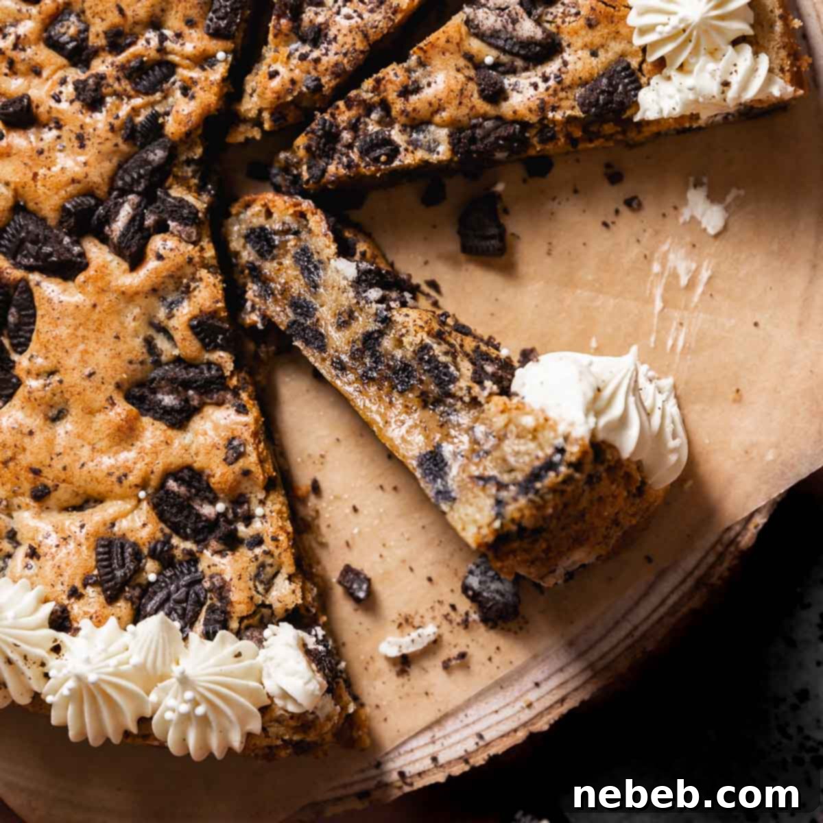 Slices of Oreo cookie cake decorated with a vanilla frosting border.