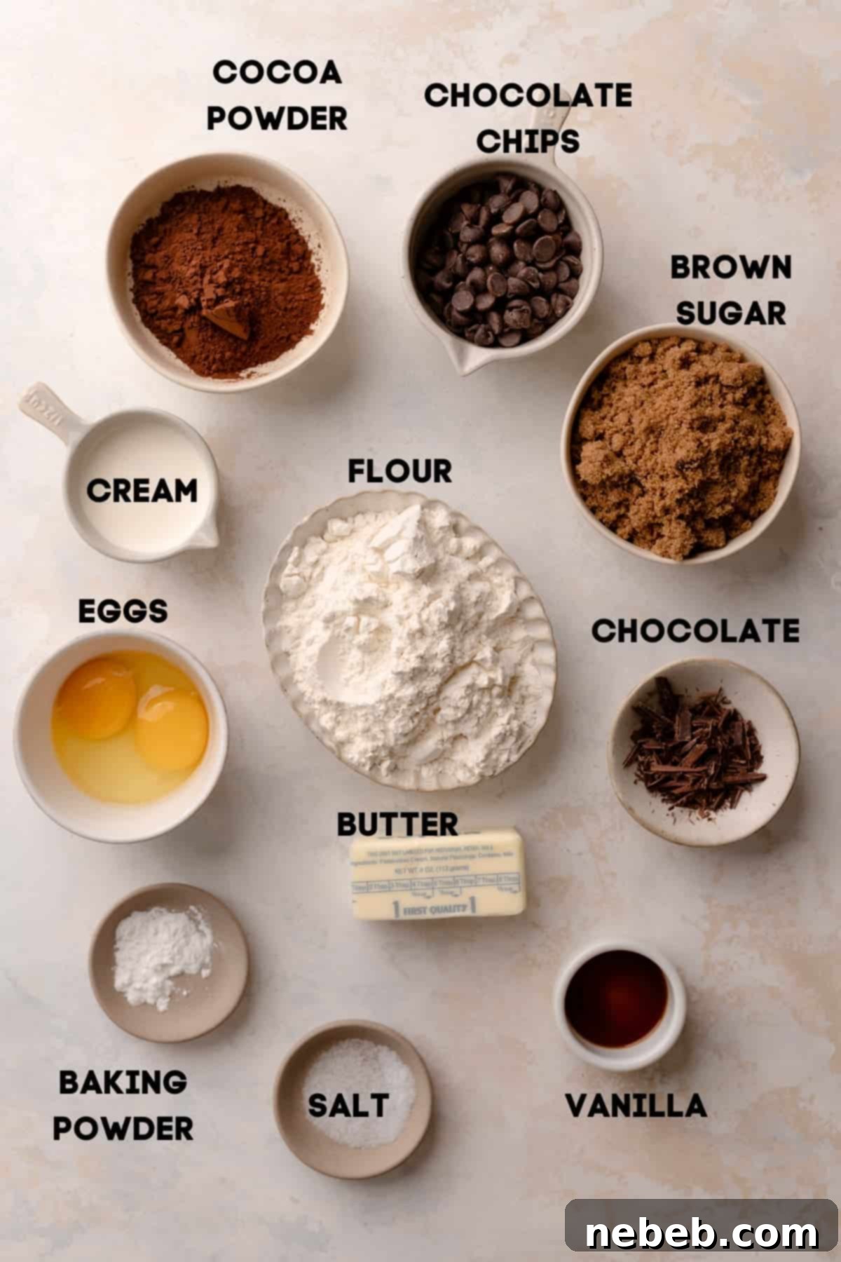 Individual bowls containing all the necessary ingredients to make chocolate thumbprint cookies, each clearly labeled.