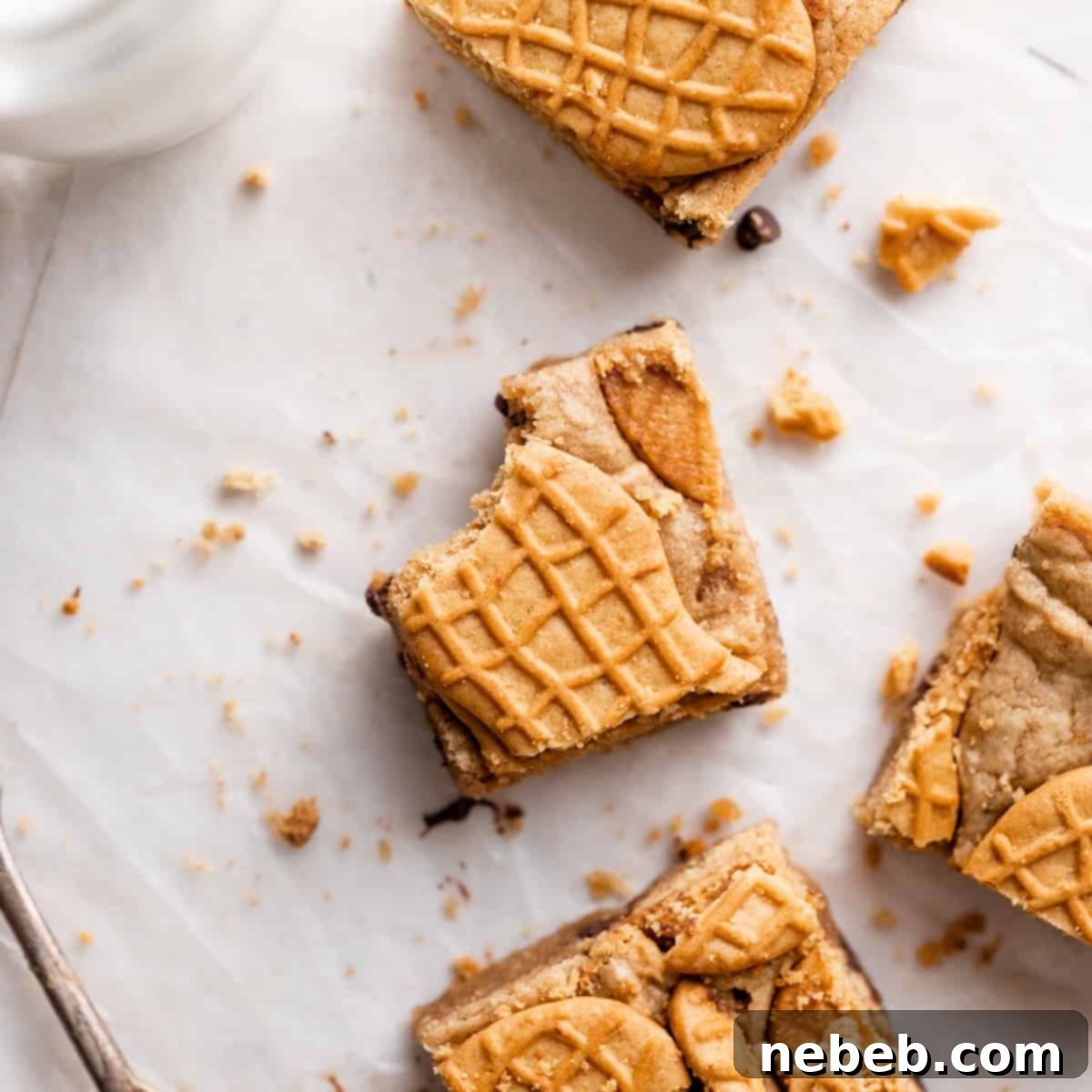 A featured image of a Nutter Butter bar, with a bite taken, highlighting the cookie on top and its chewy texture.