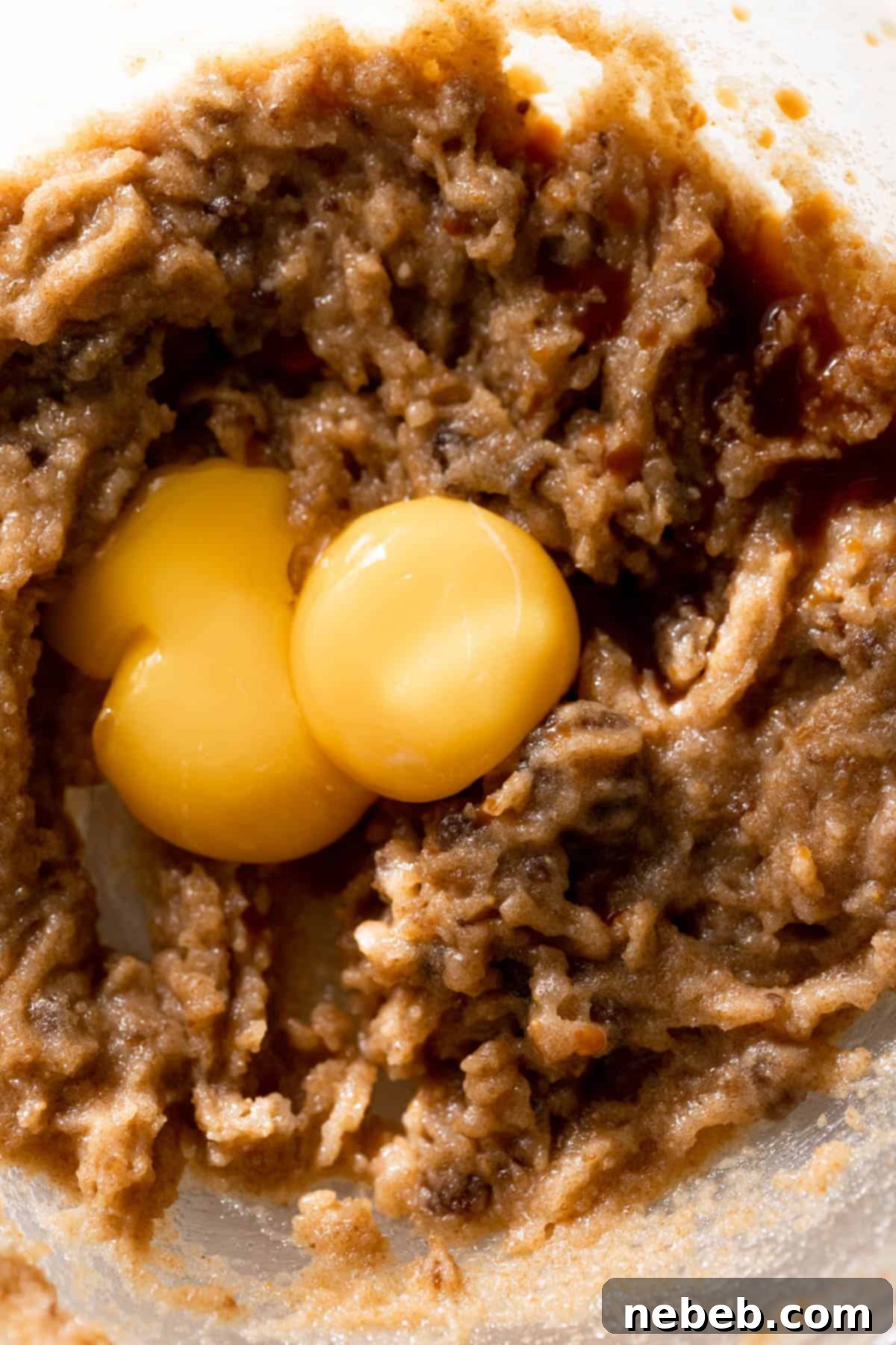 Spiced Pumpkin Snickerdoodle Delights 7 Two egg yolks on top of the whisked butter and sugar.