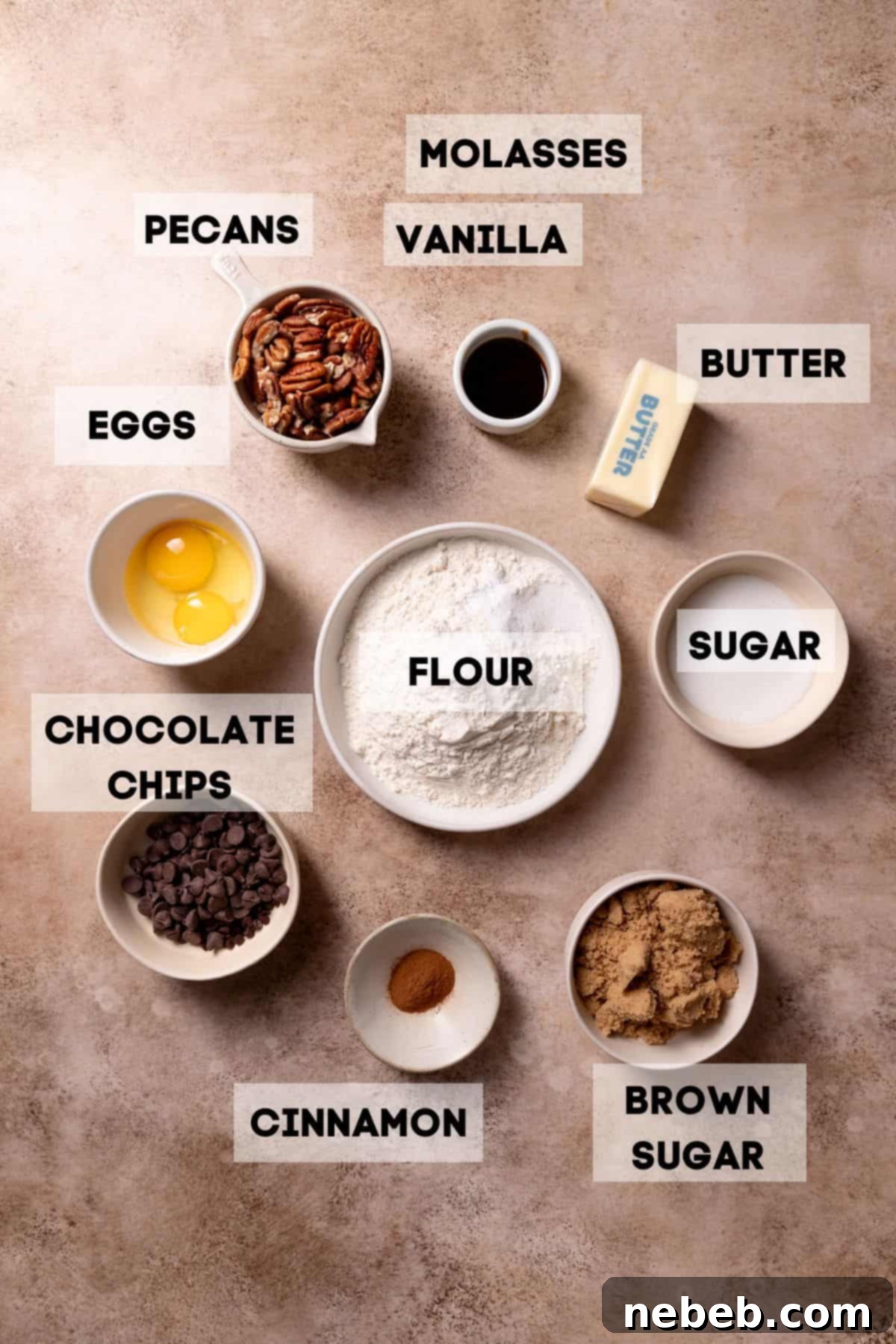 Bowls of ingredients for chocolate pecan cookies including pecan halves, two types of chocolate chips, molasses, and dry ingredients, neatly arranged with labels.