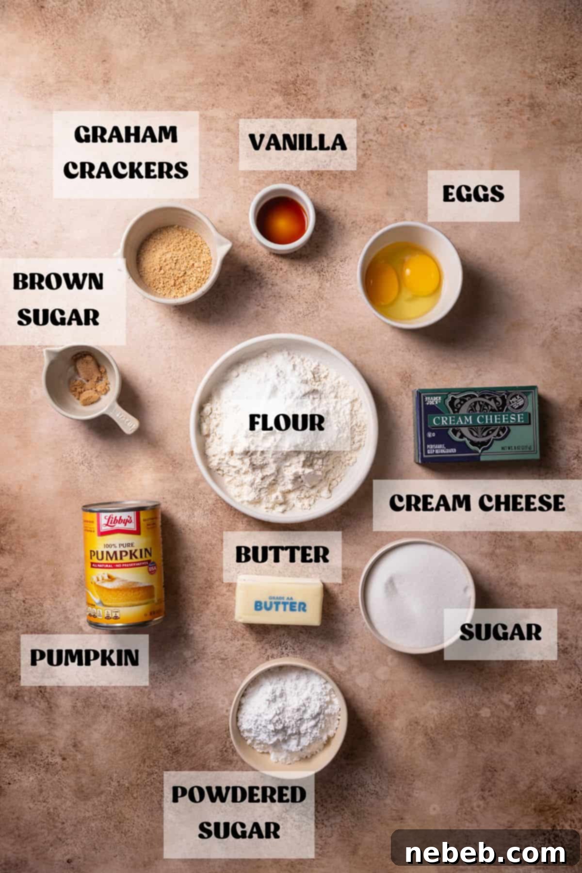 Bowls of ingredients for cream cheese pumpkin cookies, including pumpkin puree, cream cheese, eggs, and butter.