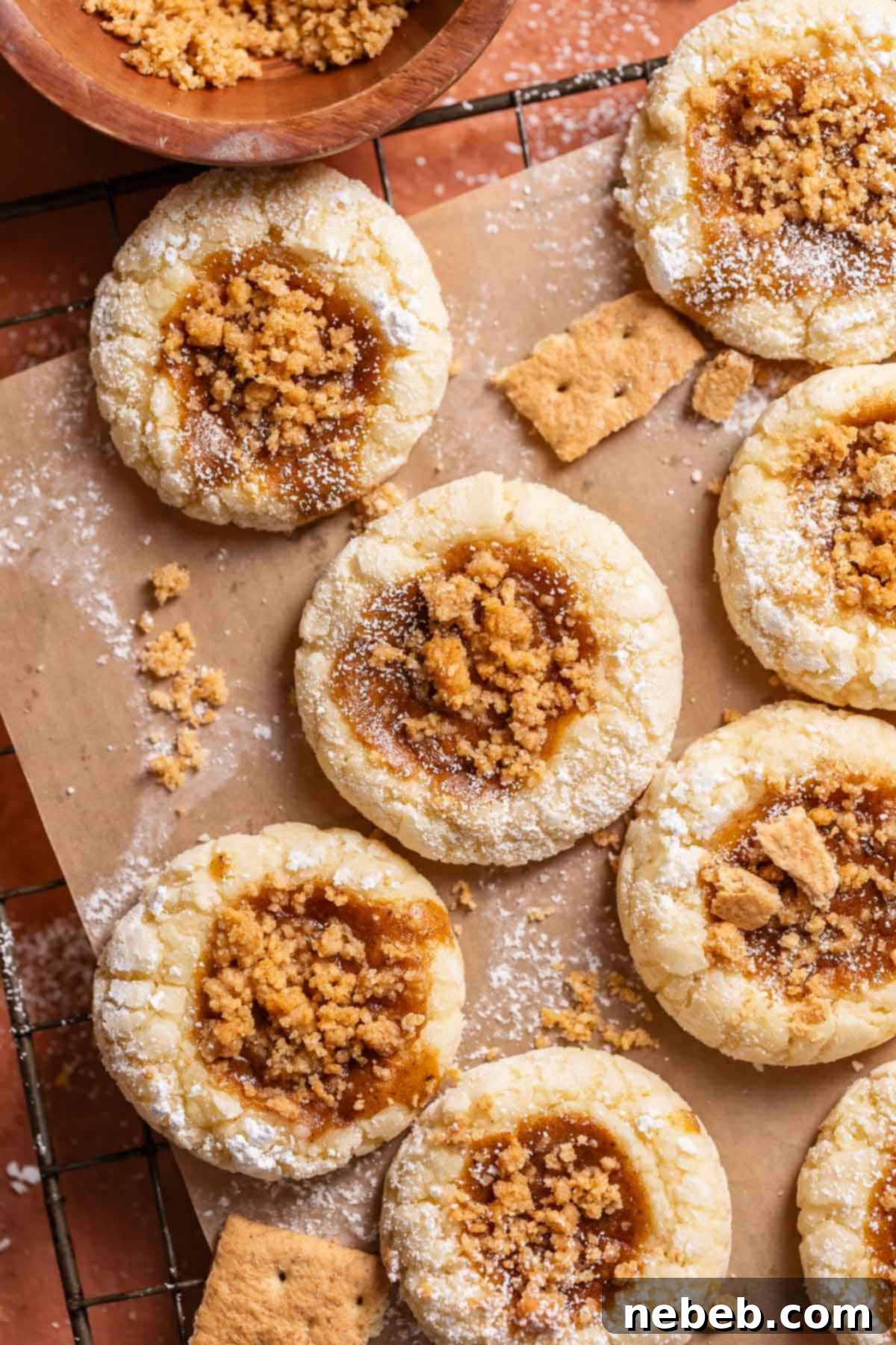 Beautifully baked pumpkin cheesecake cookies, garnished with powdered sugar, ready to be enjoyed.