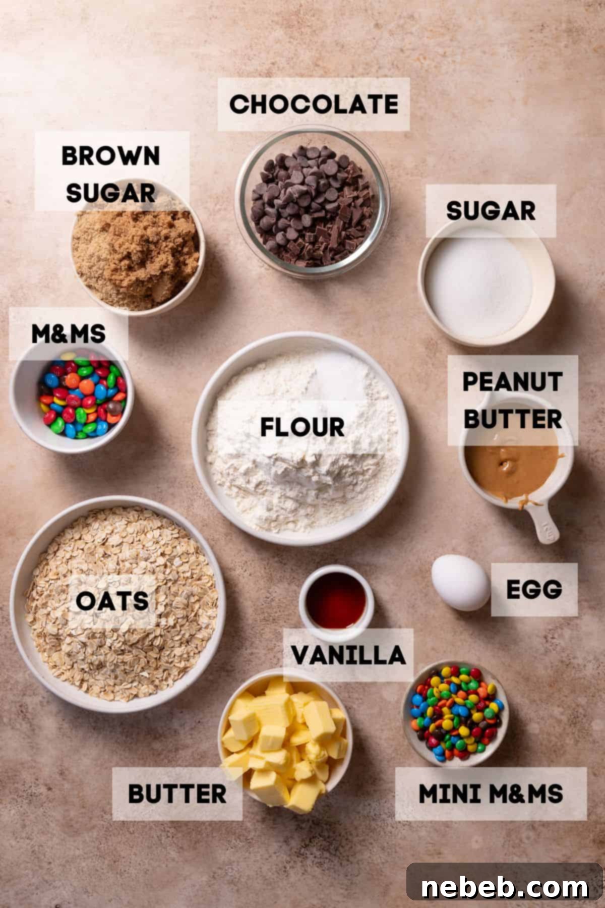 Ultimate Monster Cookie Bars 3 Ingredients for monster cookie bars in bowls with labels.