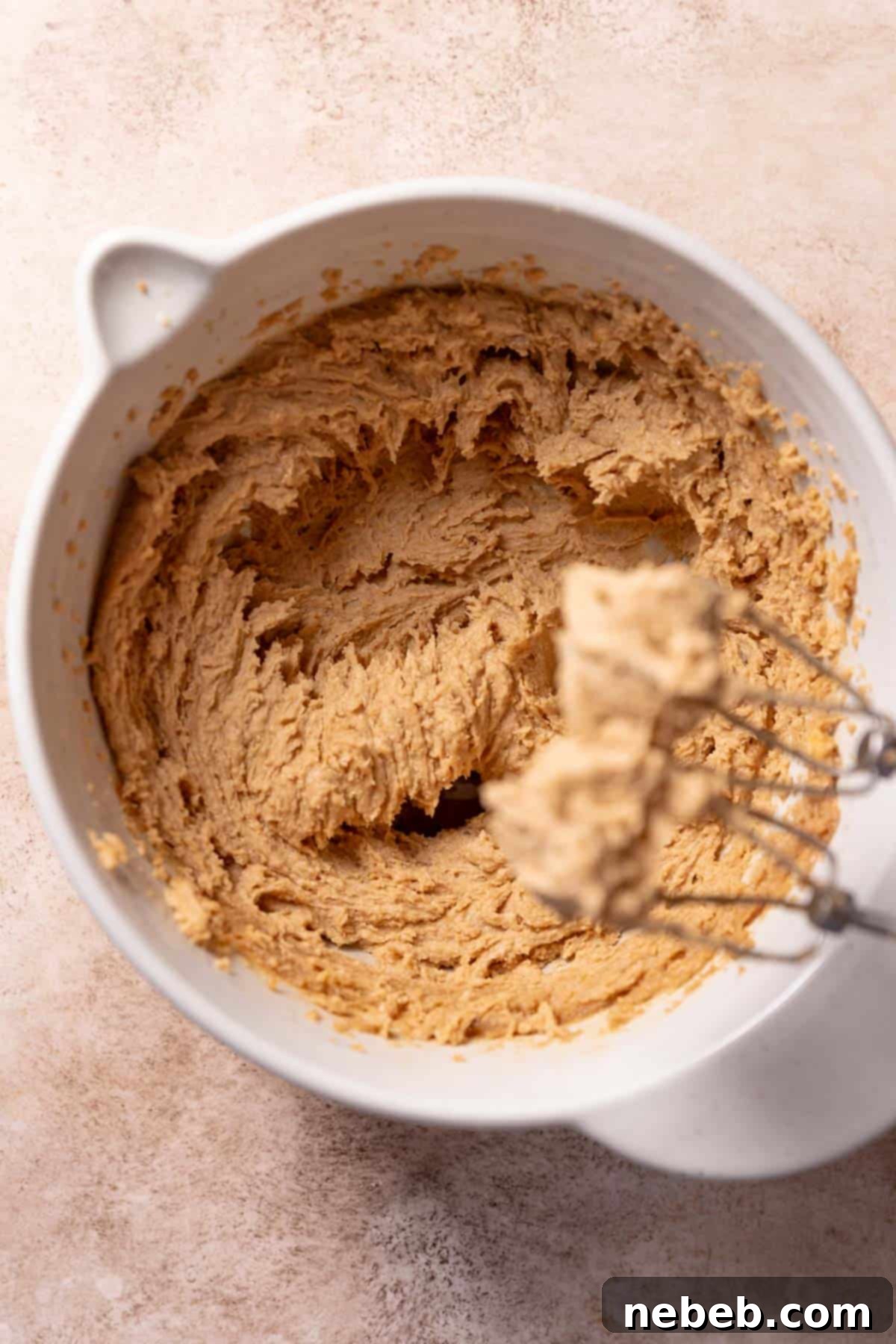 Ultimate Monster Cookie Bars 4 A mixing bowl with the creamed butter, sugar, and peanut butter.
