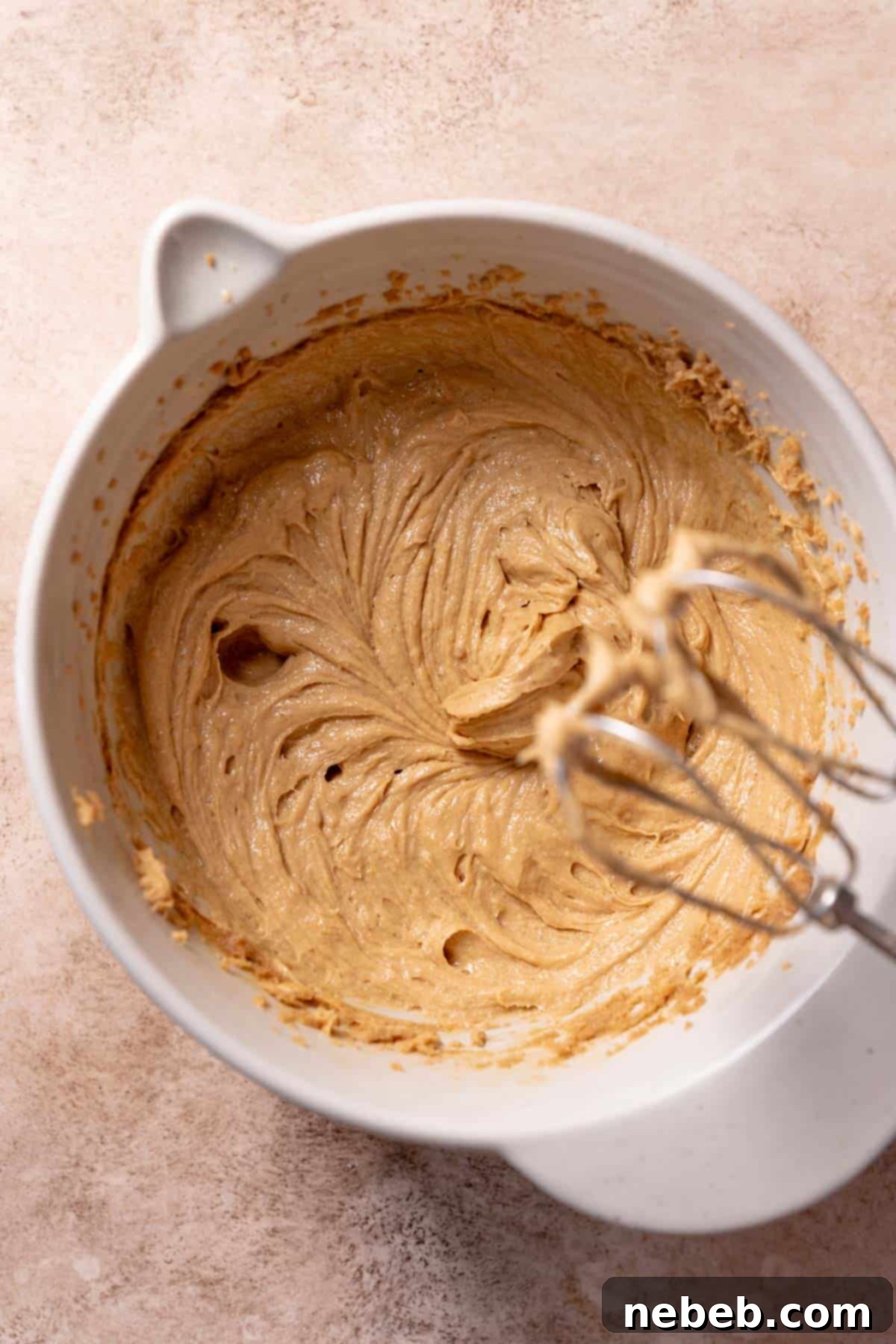 Ultimate Monster Cookie Bars 5 A mixing bowl with the creamed wet ingredients.