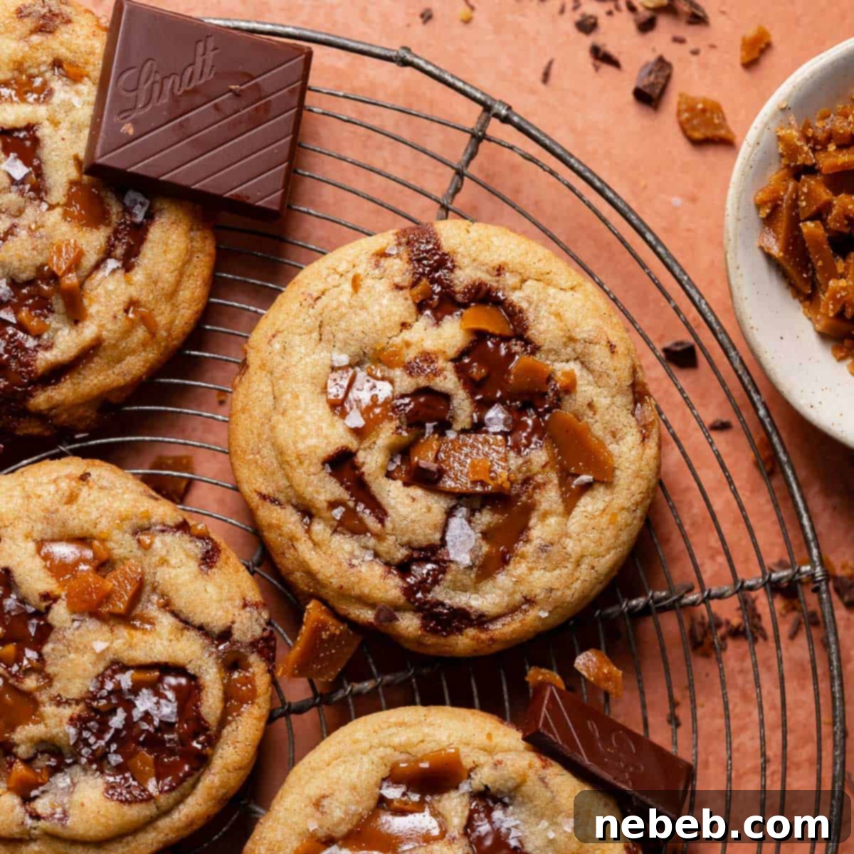 Decadent Brown Butter Toffee Chocolate Chip Cookies 11 Brown butter toffee chocolate chip cookies on a wire cooling rack.