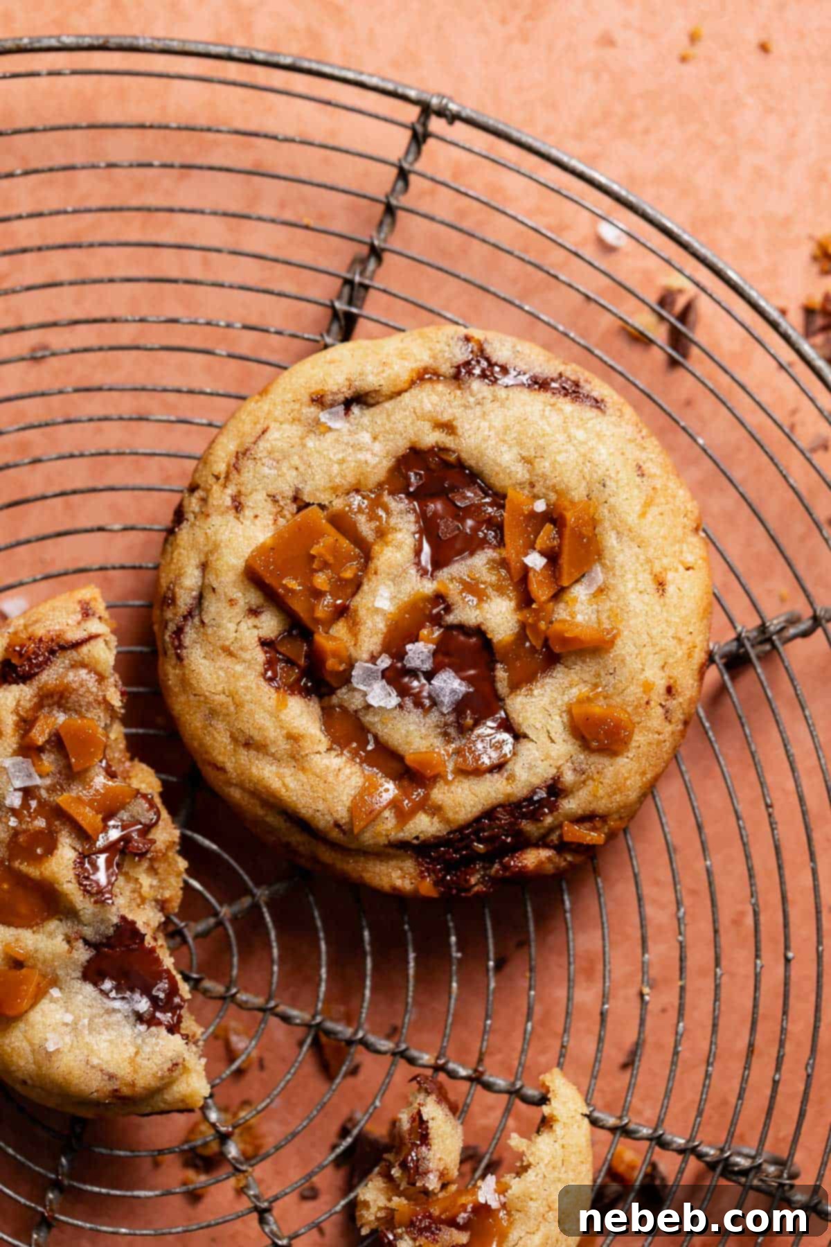 Decadent Brown Butter Toffee Chocolate Chip Cookies 9 Chocolate chip toffee cookie on a wire cooling rack after baking.