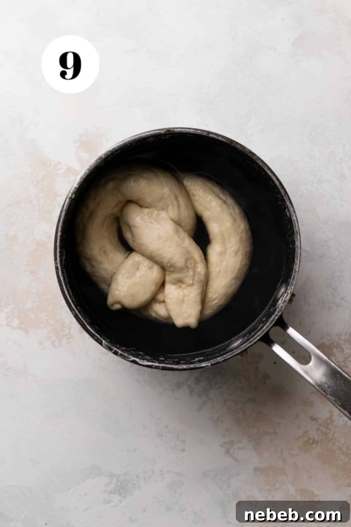 Creamy Spinach Artichoke Stuffed Pretzels 8 boiling the stuffed pretzel in baking soda water before baking.