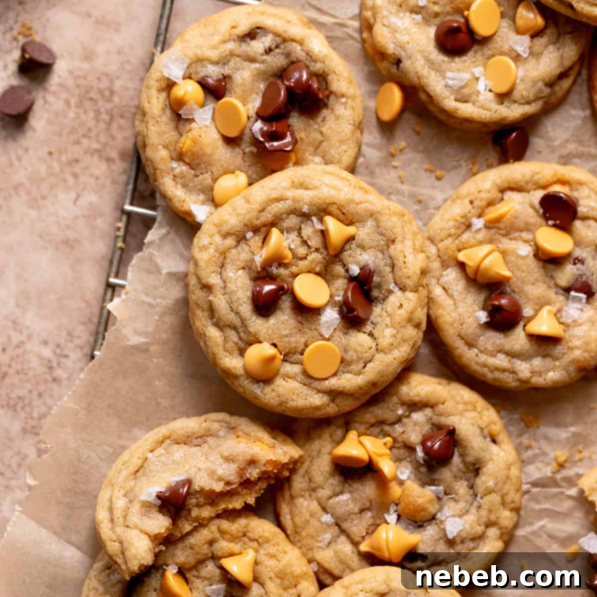 A delicious stack of butterscotch cookies generously studded with chocolate chips, presented on parchment paper.
