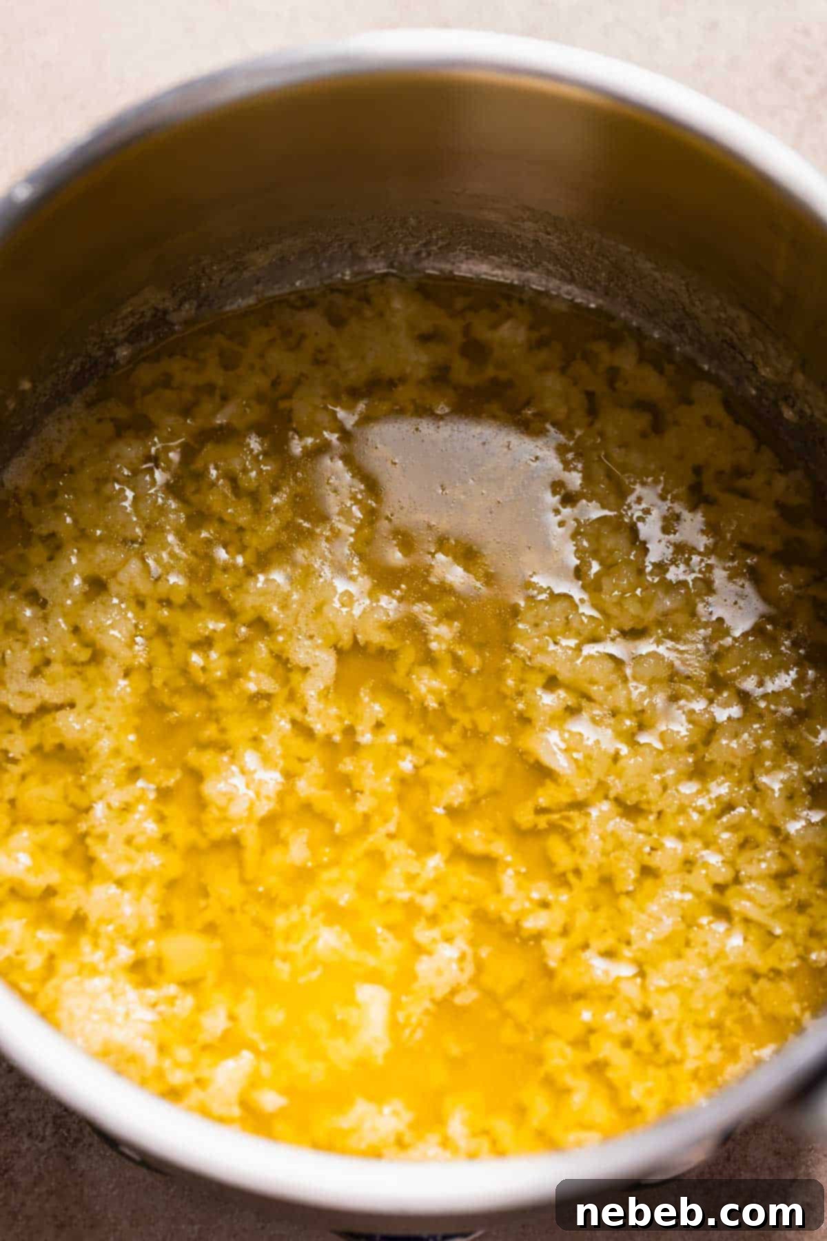 A pot of melted butter and garlic.