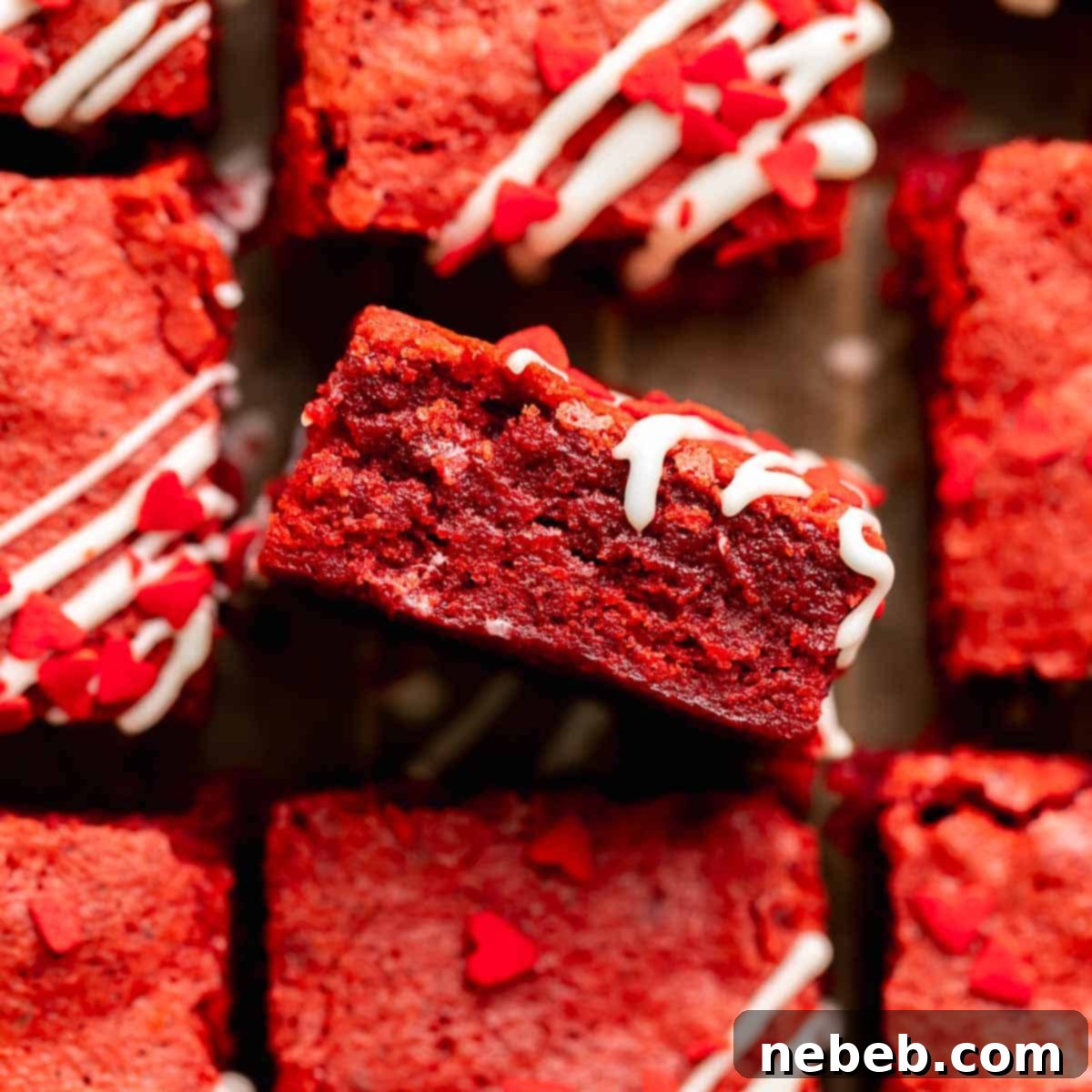 Fudgy red velvet brownies with cream cheese icing and red heart sprinkles.