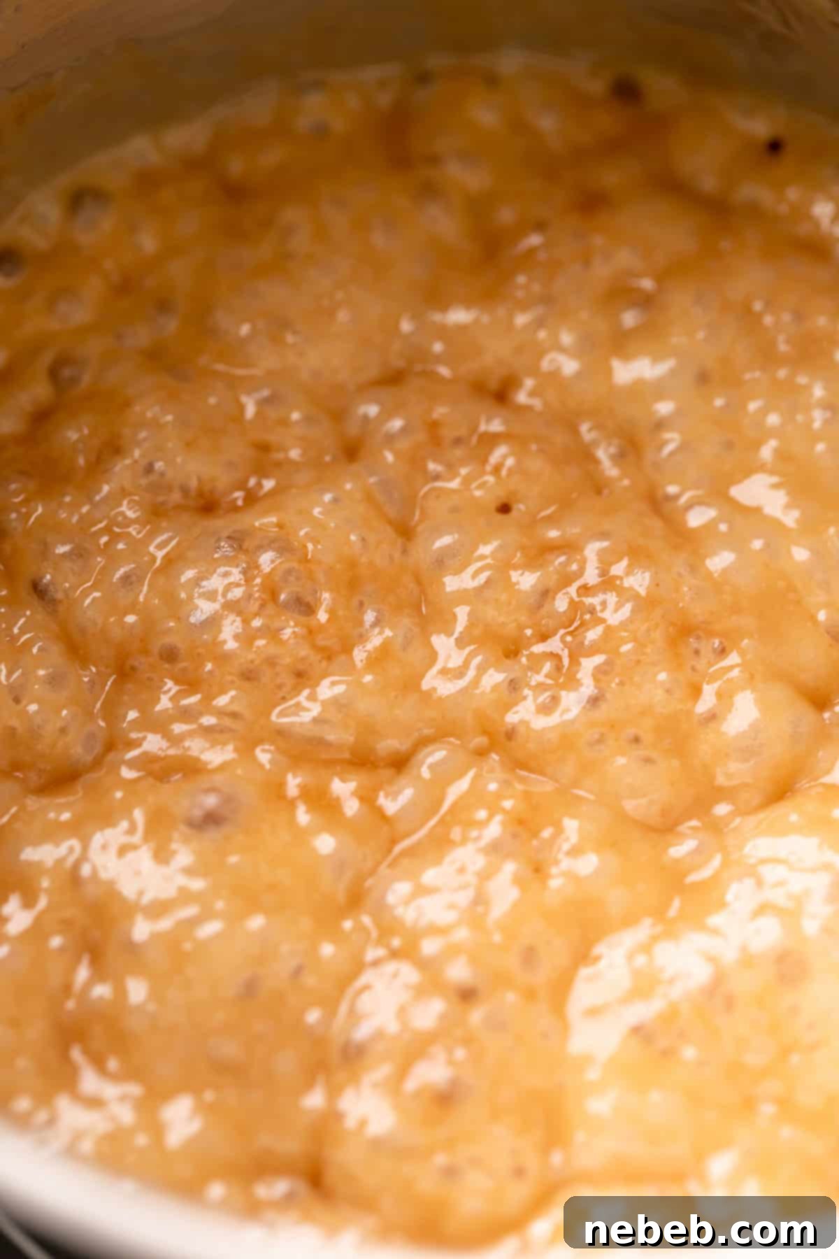 golden brown caramel bubbling in a pot.