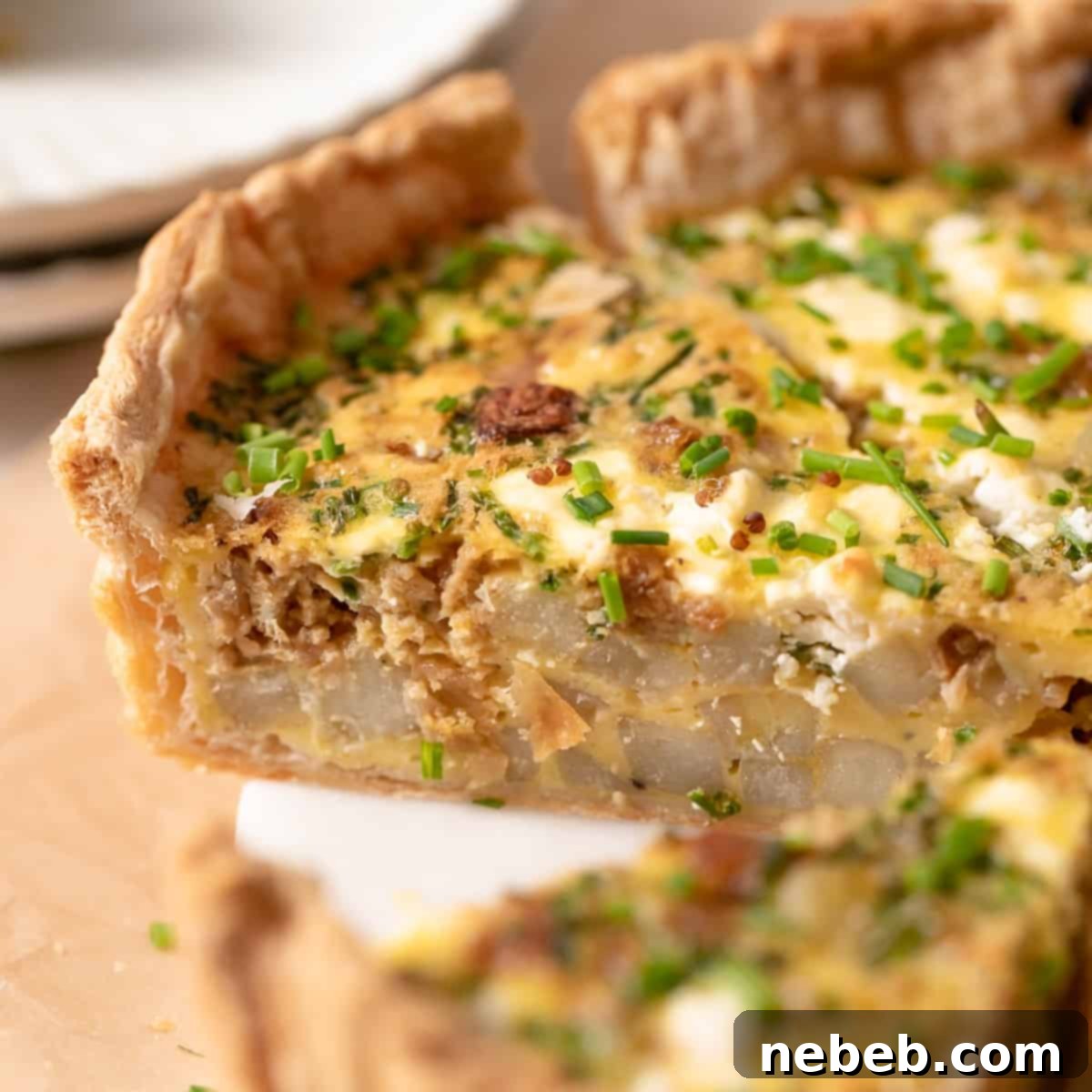 Flaky Deep Dish Quiche 6 Puff pastry quiche cut into slices, showcasing its flaky crust and rich filling.
