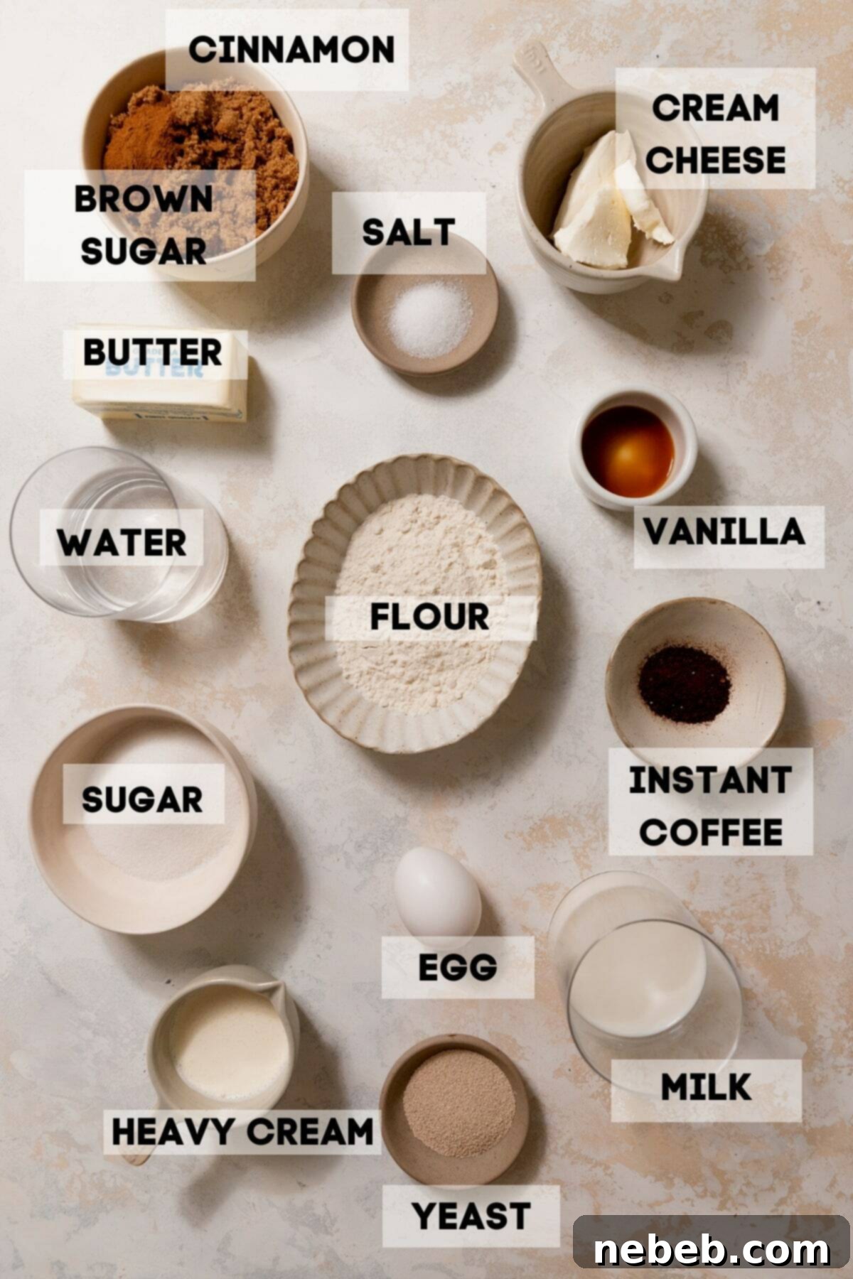 ingredients needed to make cinnamon rolls in bowls with labels.