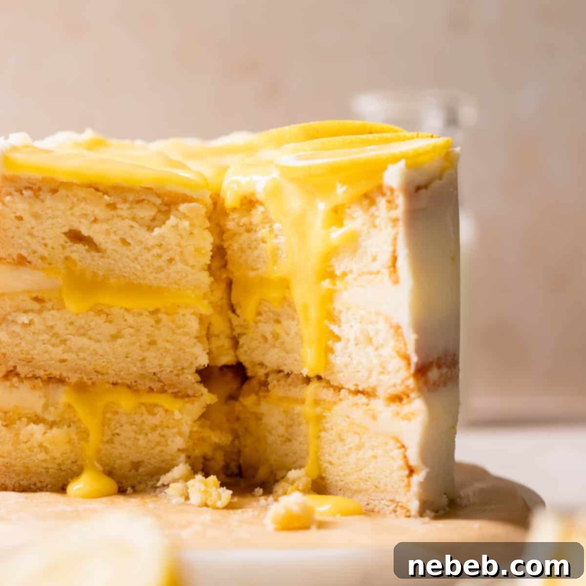 lemon bar cake with lemon curd and fresh lemon slices.