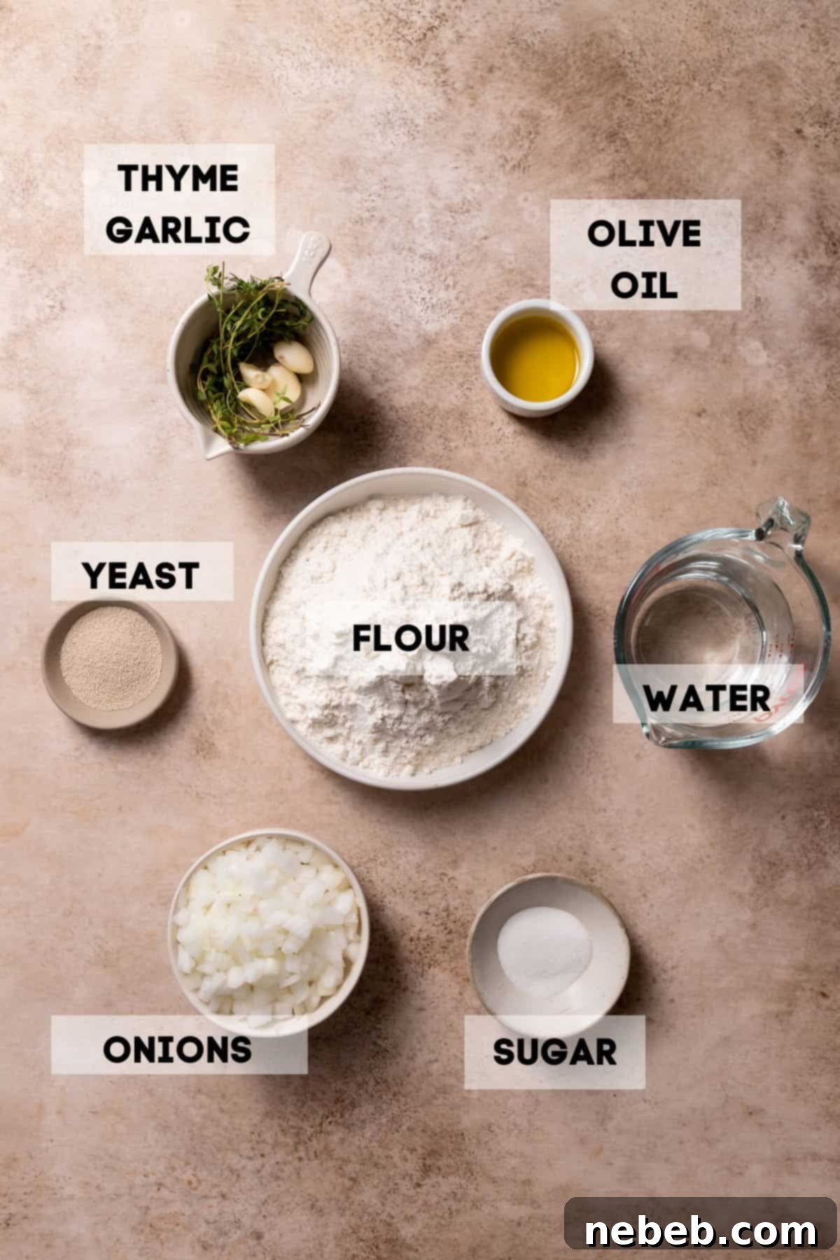 Ingredients laid out in bowls, including yellow onions, olive oil, thyme, and garlic, for making caramelized onion focaccia.