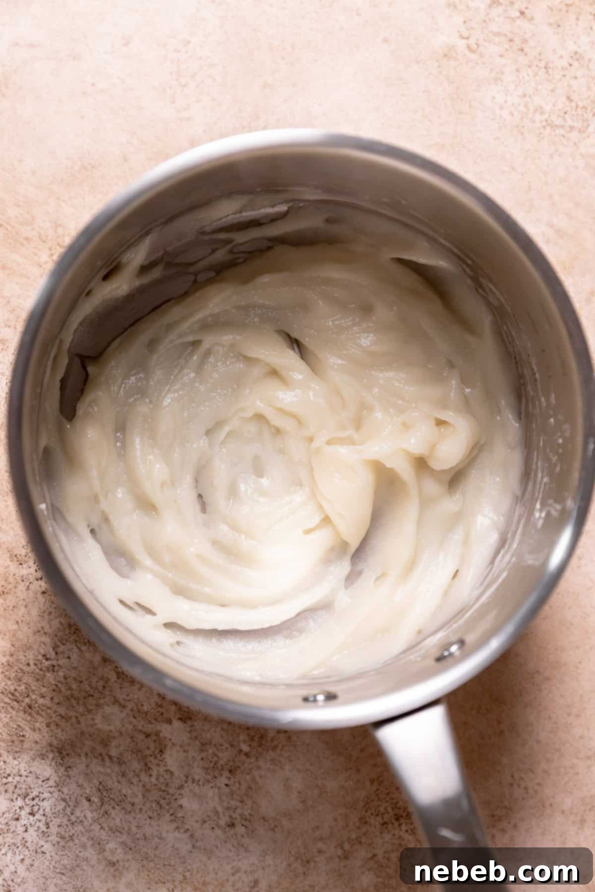 A small pot containing the cooked tangzhong roux, a thick flour and water paste.