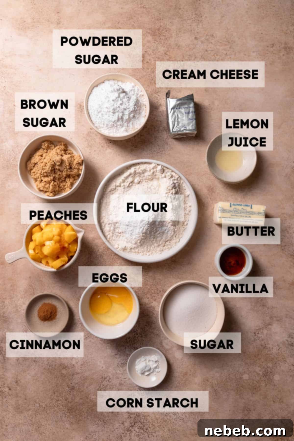 Ingredients for homemade peach cobbler cookies laid out in bowls with labels, including fresh peaches, various sugars, butter, and spices.