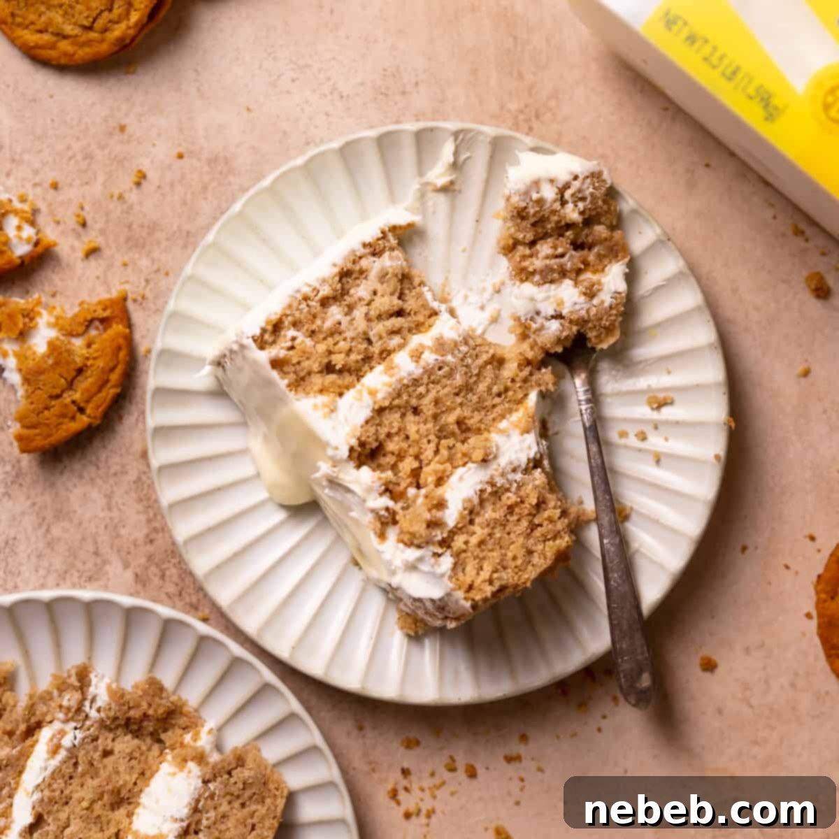 Oatmeal Cream Dream Cake 8 a slice of oatmeal cream pie cake on a plate with a fork.