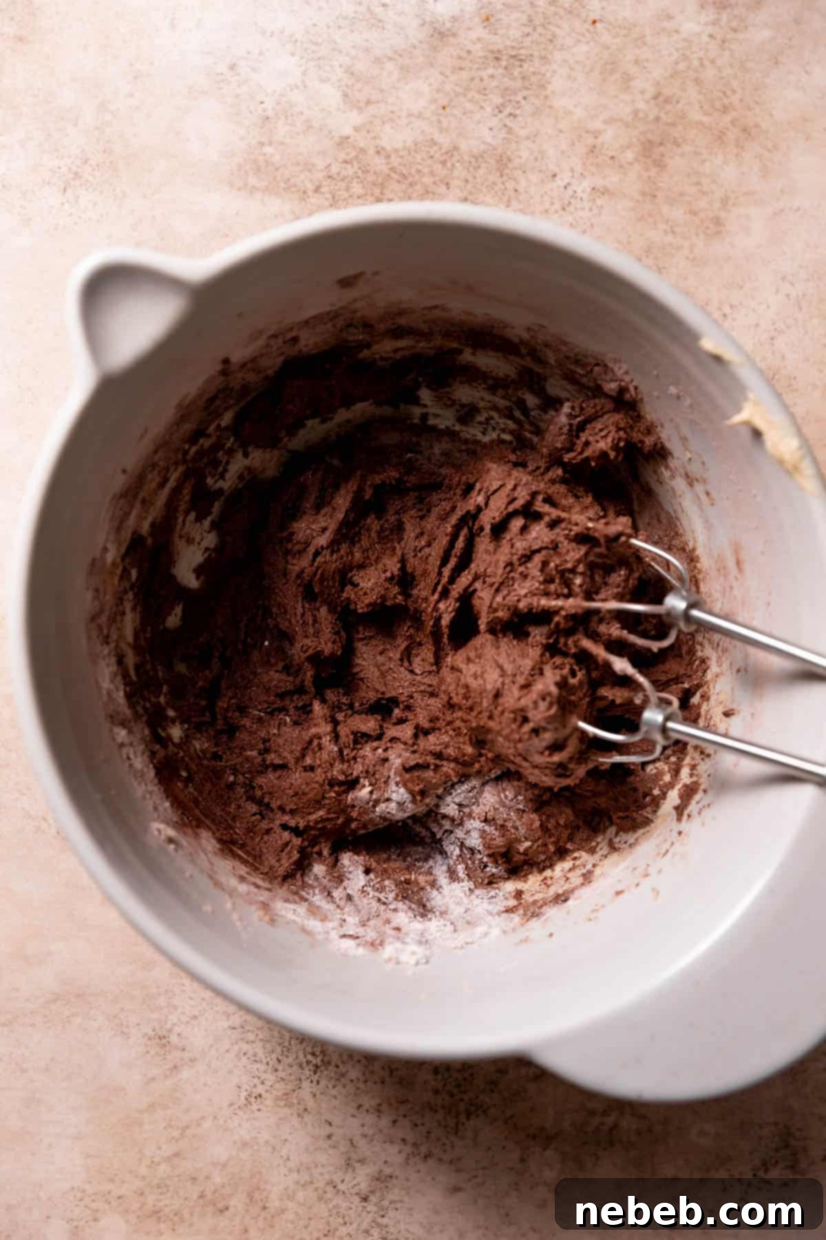 Rich chocolate cookie dough in a mixing bowl, ready for chilling.
