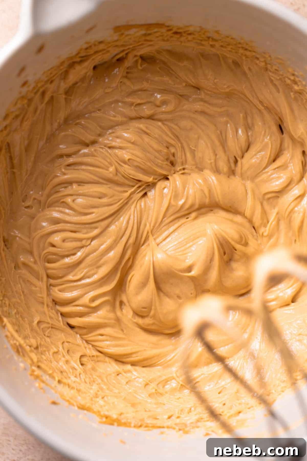 A bowl showcasing the finished, fluffy peanut butter filling after thorough mixing.