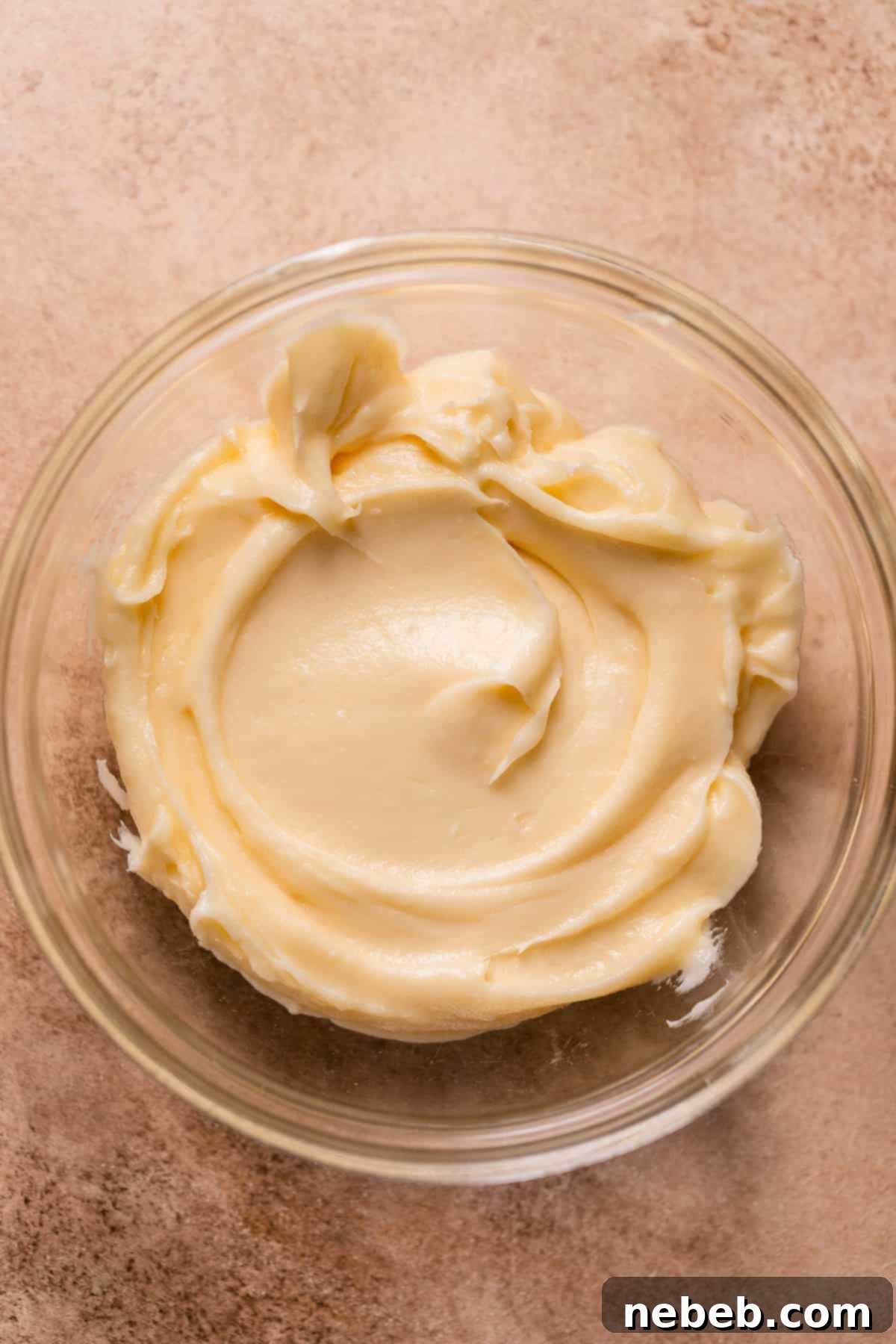 Cream cheese frosting in a bowl.