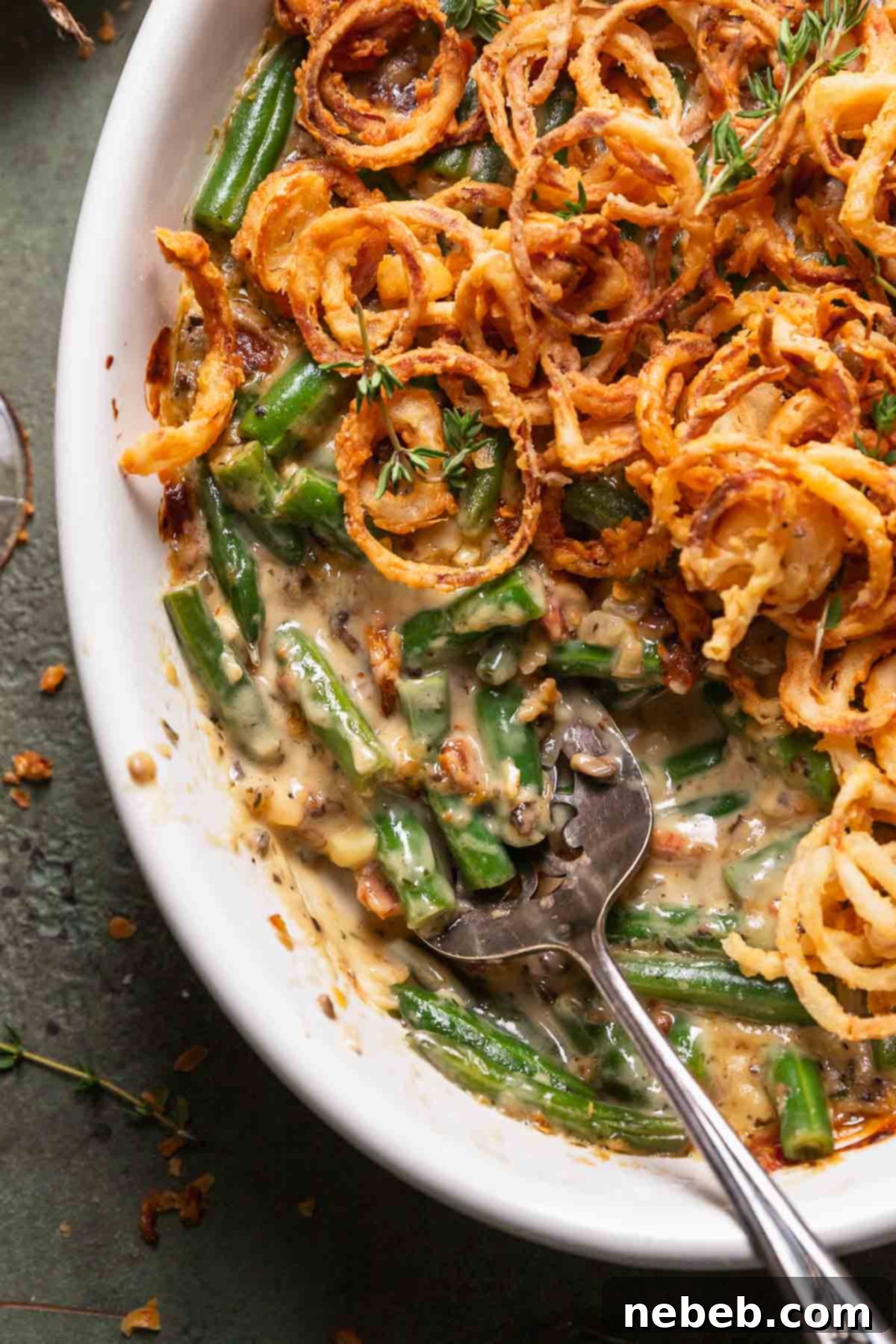 A close-up view of the creamy, cheesy green bean casserole with perfect tender green beans.