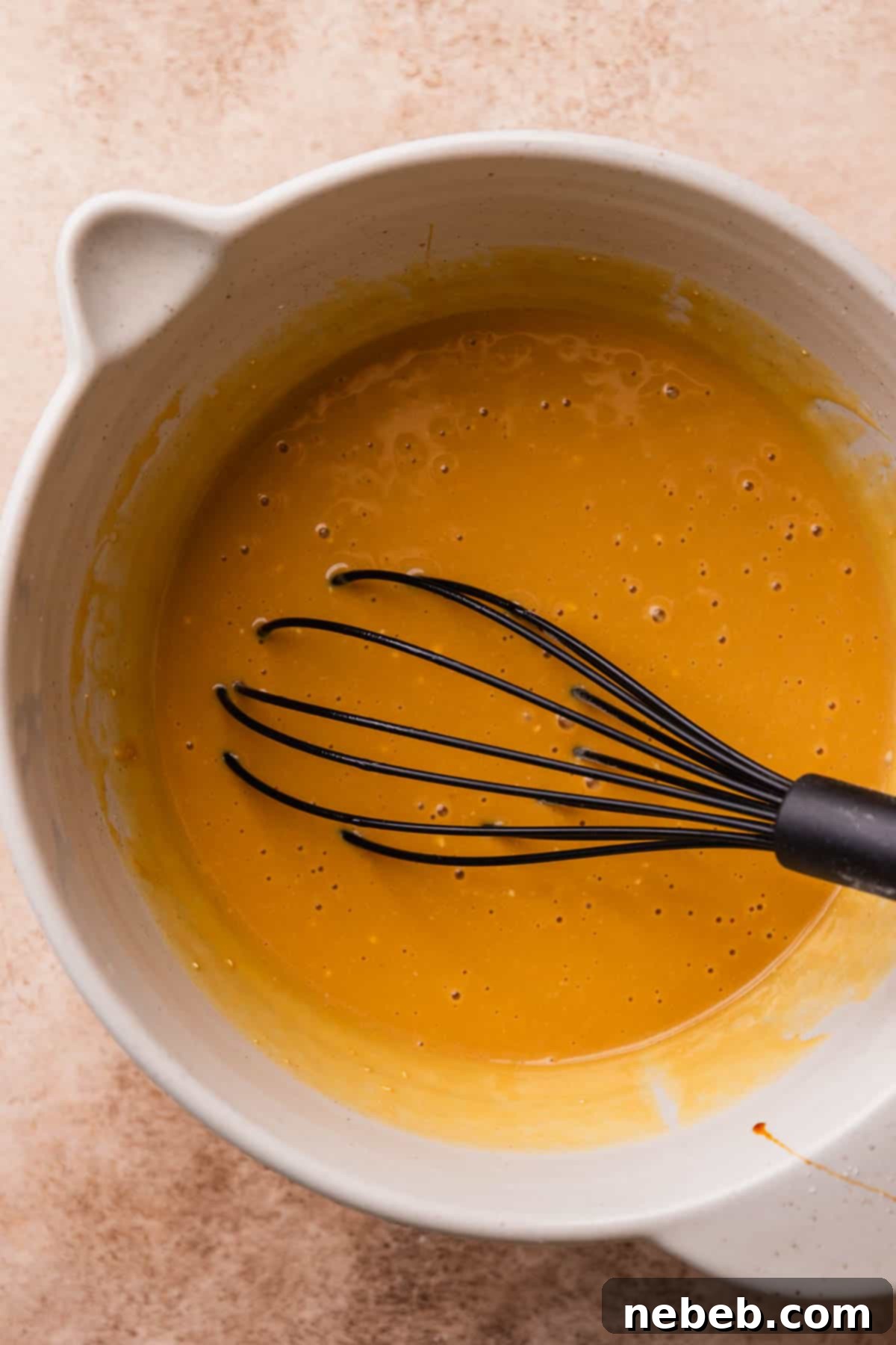 A mixing bowl with the whisked wet ingredients.