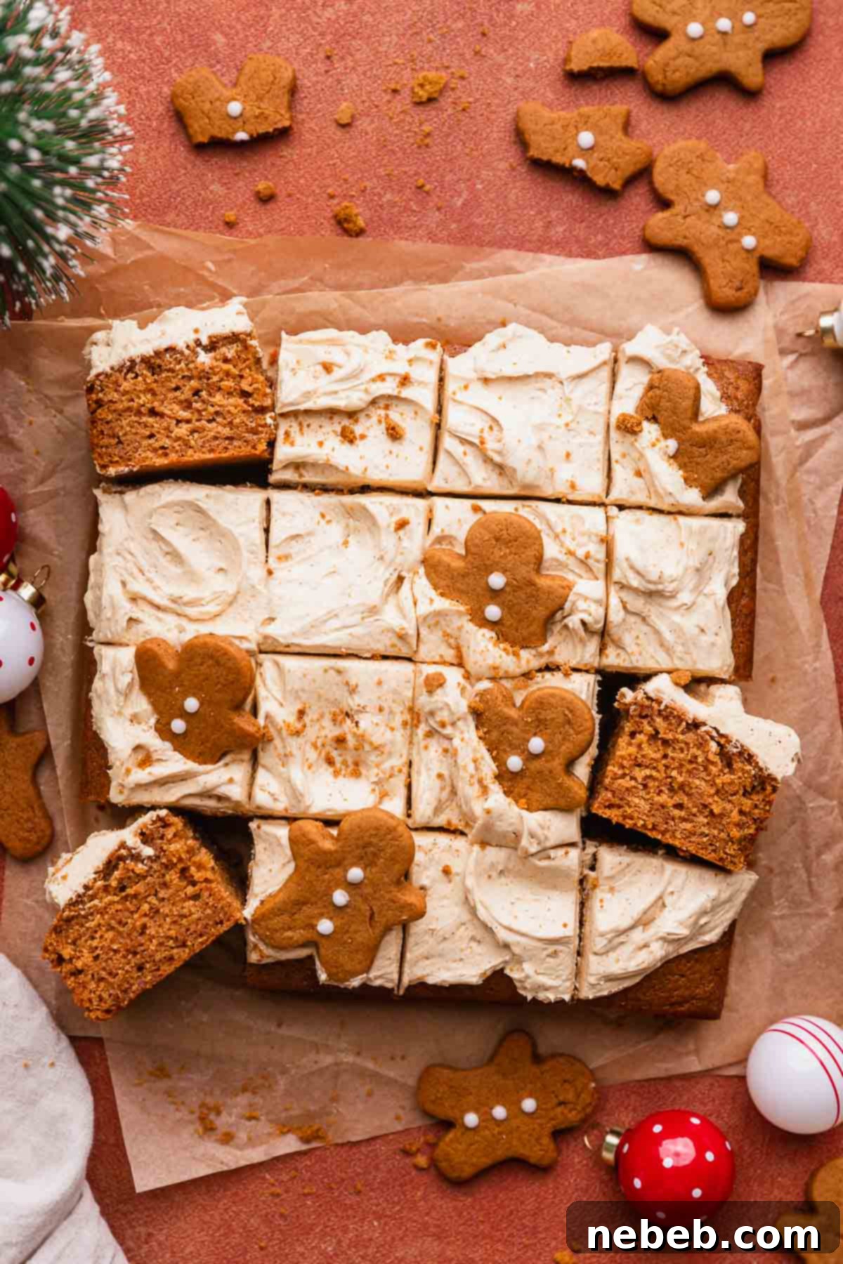 Decorated christmas gingerbread cake with mini gingerbread cookies on top.