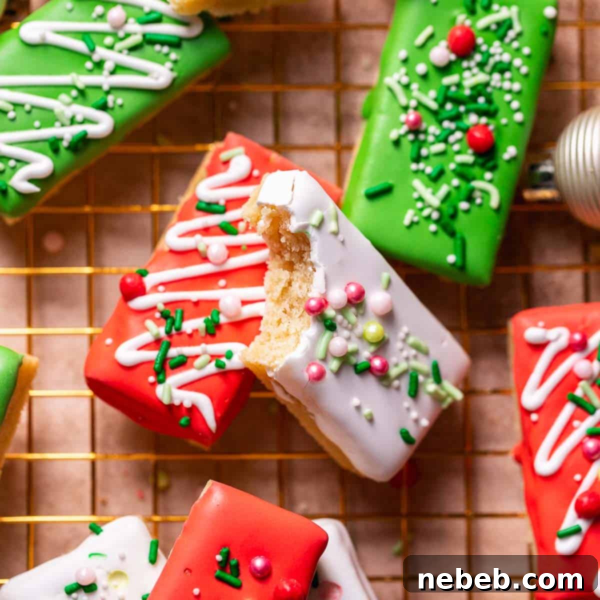 Christmas sugar cookie bars with festive sprinkles on a gold wire rack.