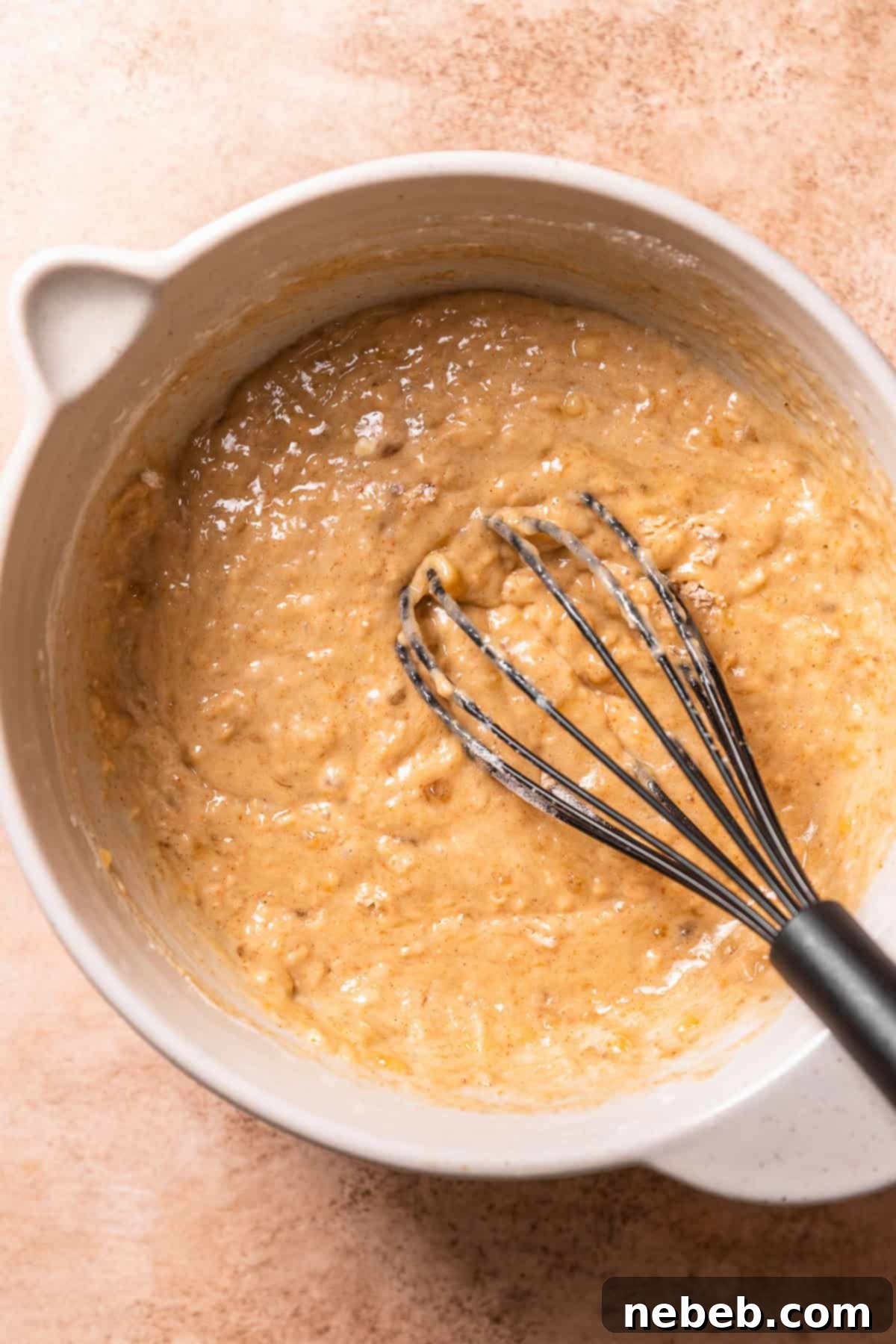 Brown butter banana bread batter in a mixing bowl.