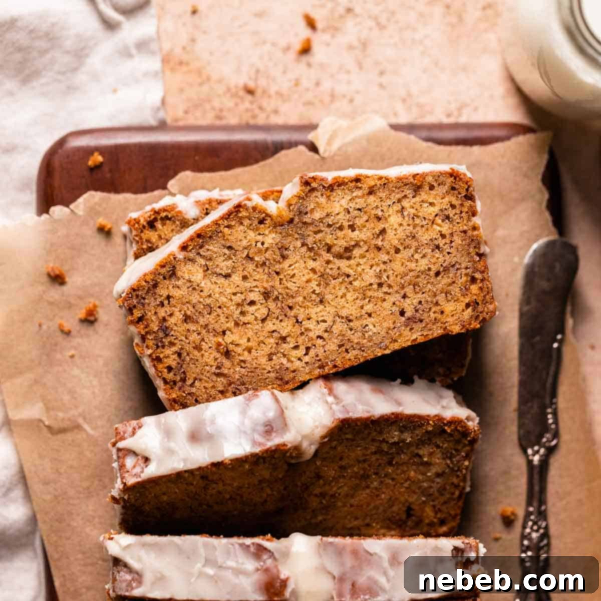 Browned butter banana bread loaf on brown parchment paper.