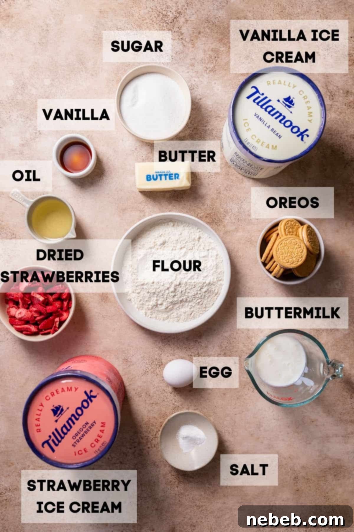 Bowls of ingredients for strawberry ice cream cake: Golden Oreos, freeze-dried strawberries, melted butter, flour, sugar, eggs, buttermilk, vanilla extract, and two tubs of ice cream.
