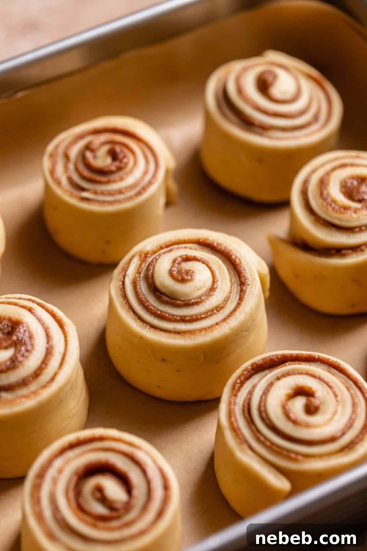 Brown butter rolls in a baking pan before baking.