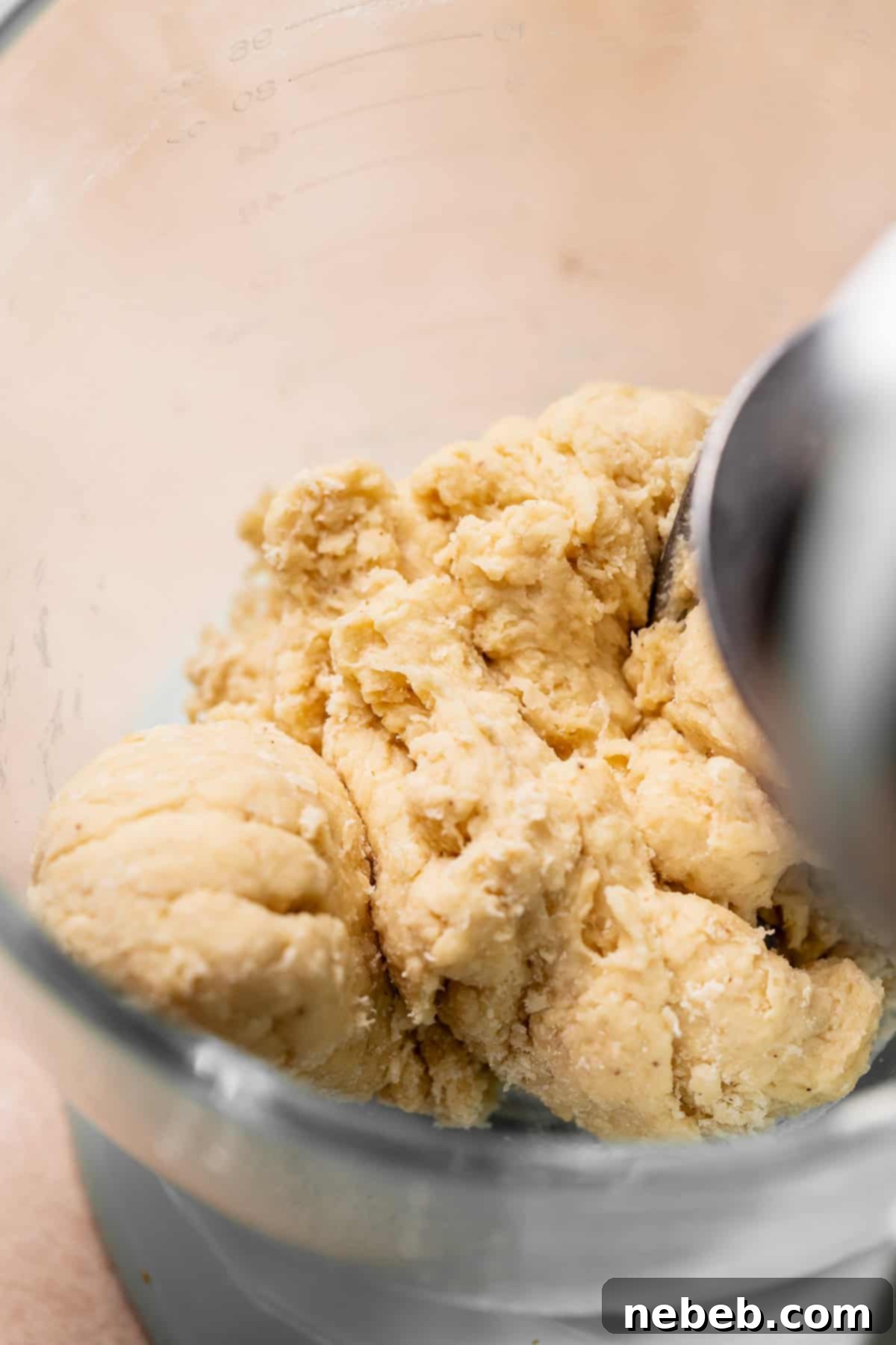 The kneaded cinnamon roll dough in a mixing bowl.