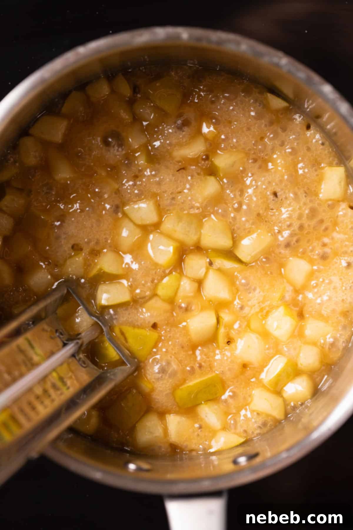 A pot of the apple caramel boiling to the correct consistency.