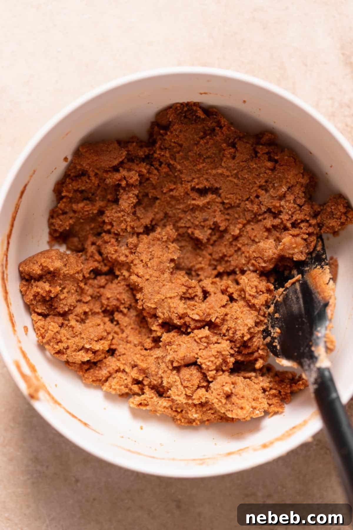 A white bowl showcasing the perfectly prepared cinnamon sugar filling, ready to be shaped.