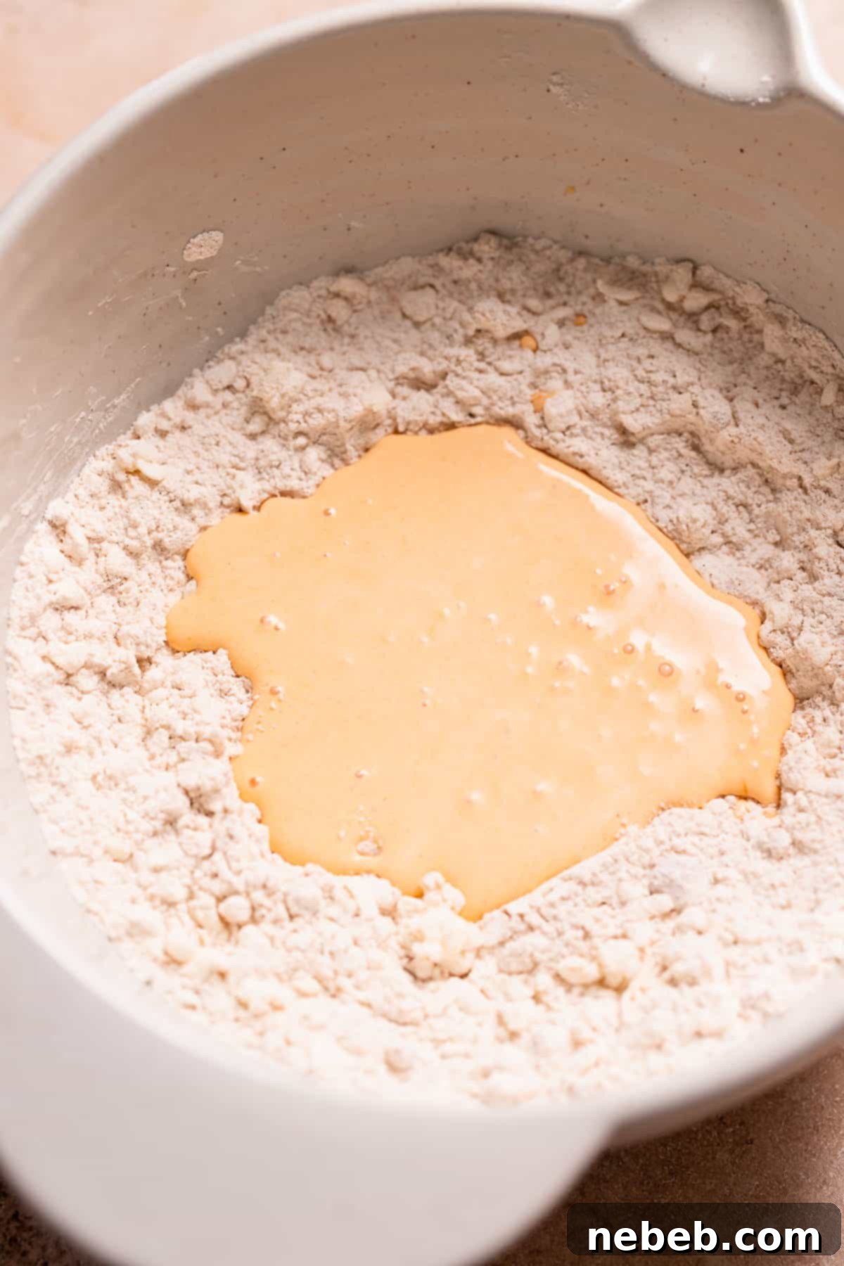 The pumpkin cream mixture poured into the center of the dry ingredients.