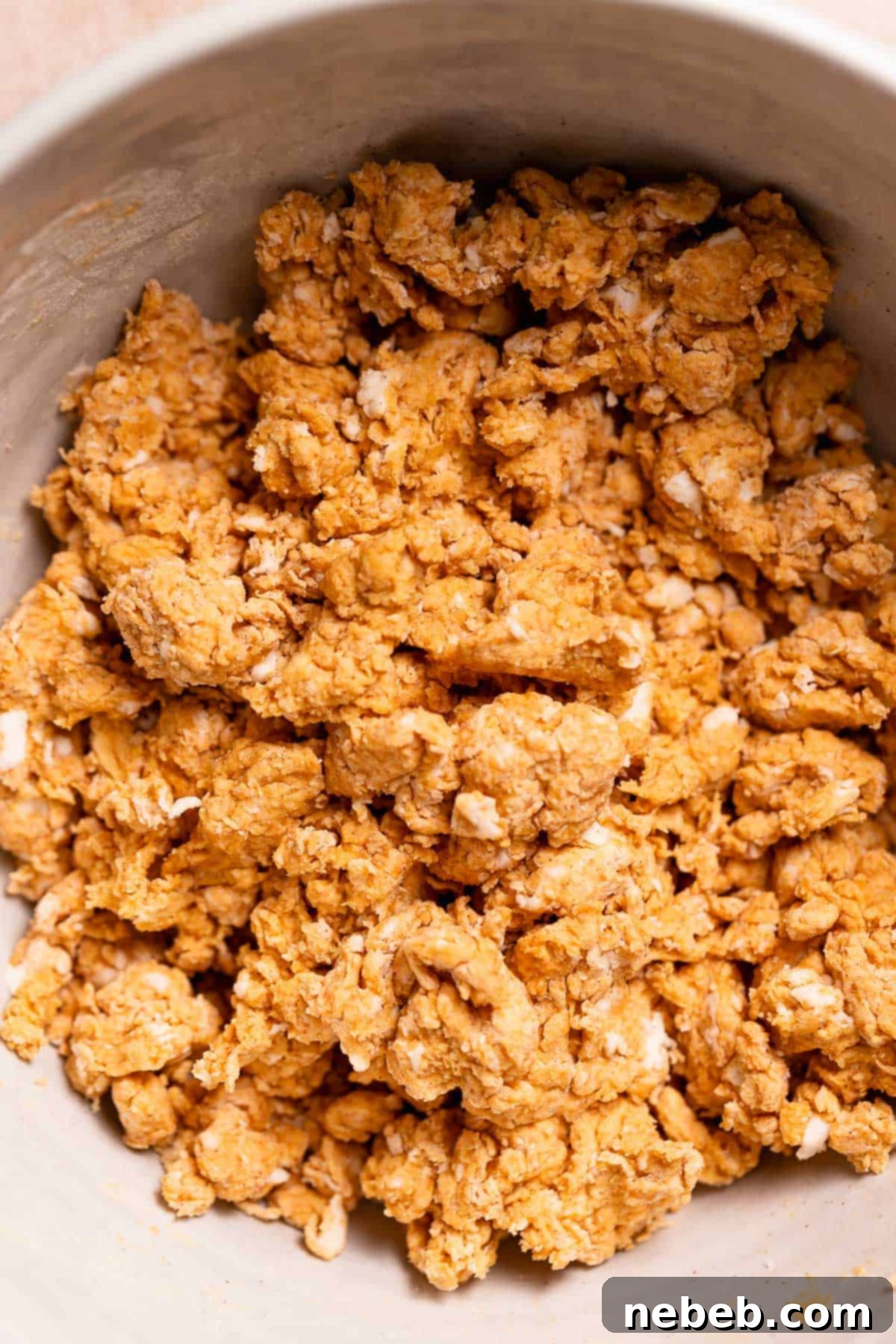 Pumpkin scone dough in a mixing bowl before shaping.