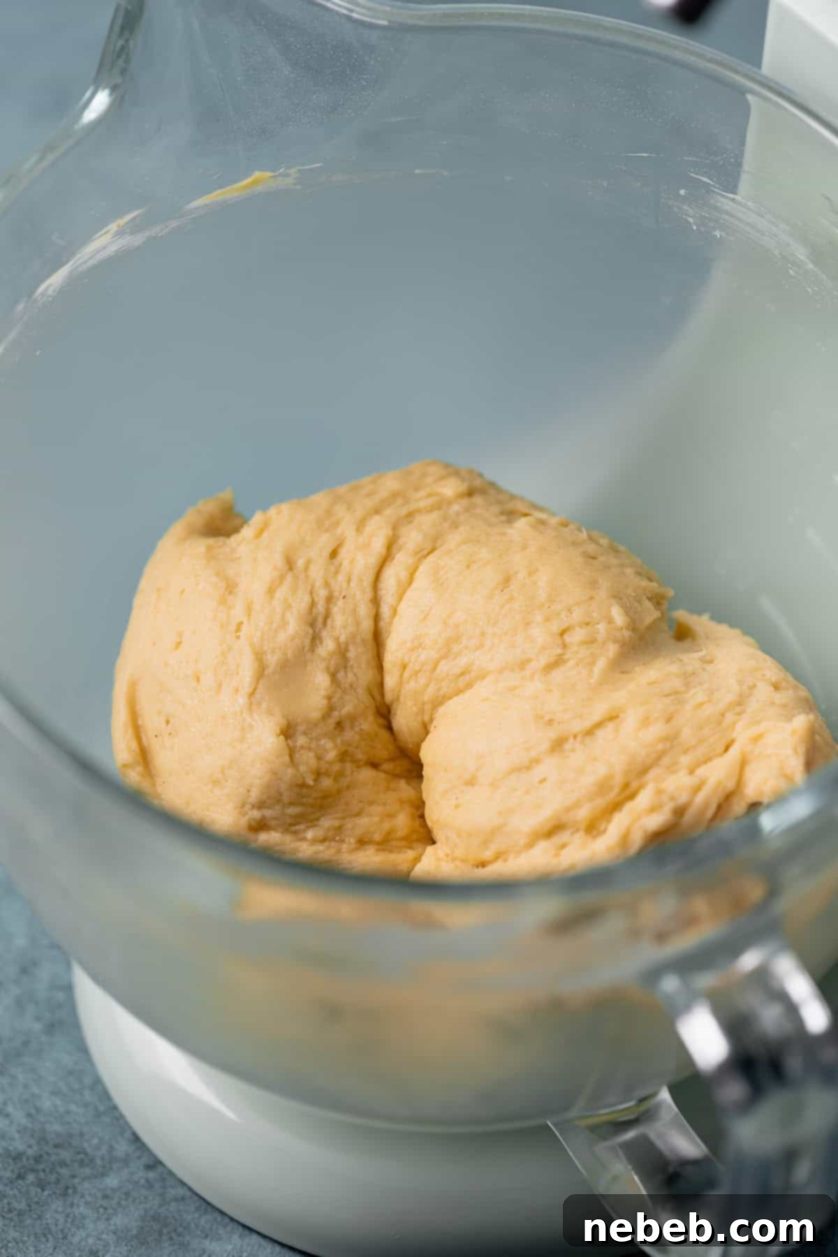 A mixing bowl with smooth, kneaded yeast dough.