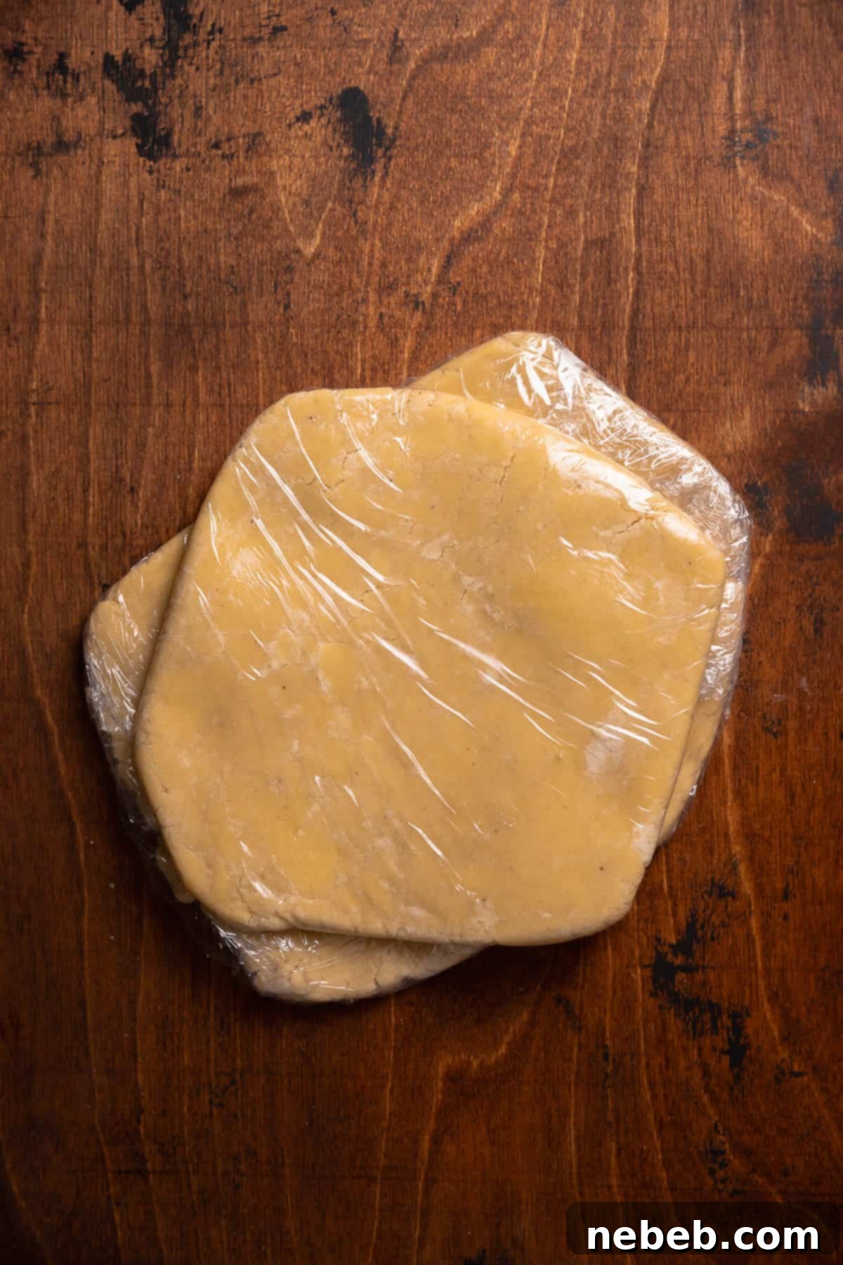 Perfect Bakery-Style Cut-Out Sugar Cookies 6 Slabs of cookie dough wrapped in plastic wrap.