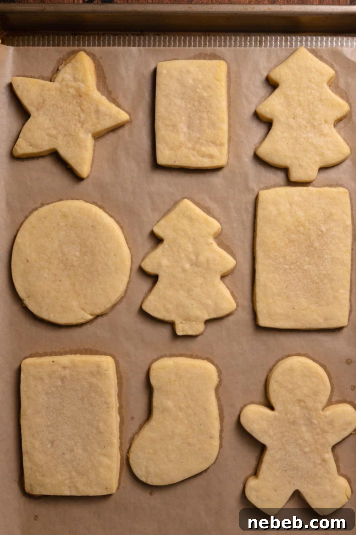 Perfect Bakery-Style Cut-Out Sugar Cookies 10 Sugar cookies on a baking tray after baking.