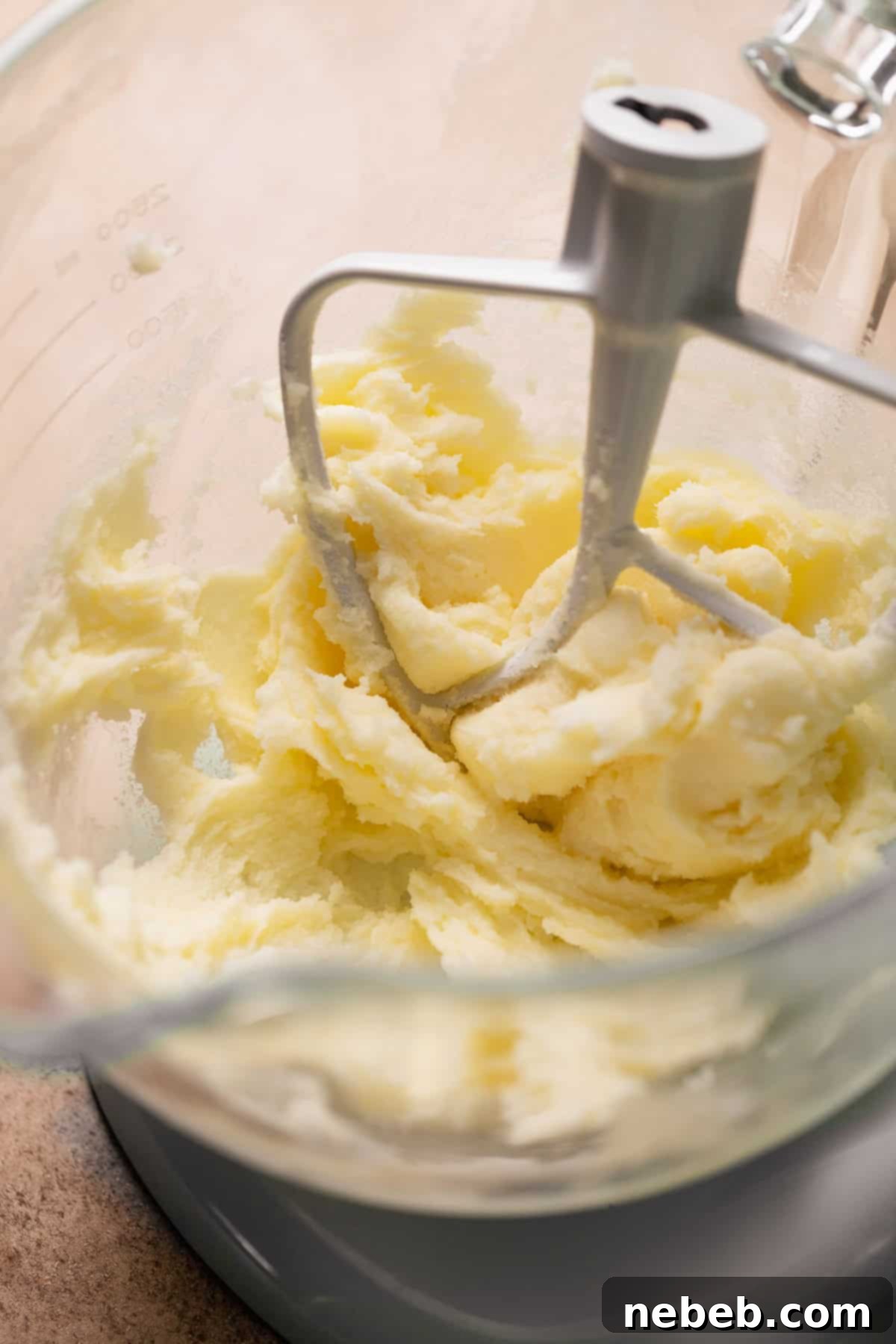 A mixing bowl with the creamed butter and sugar.